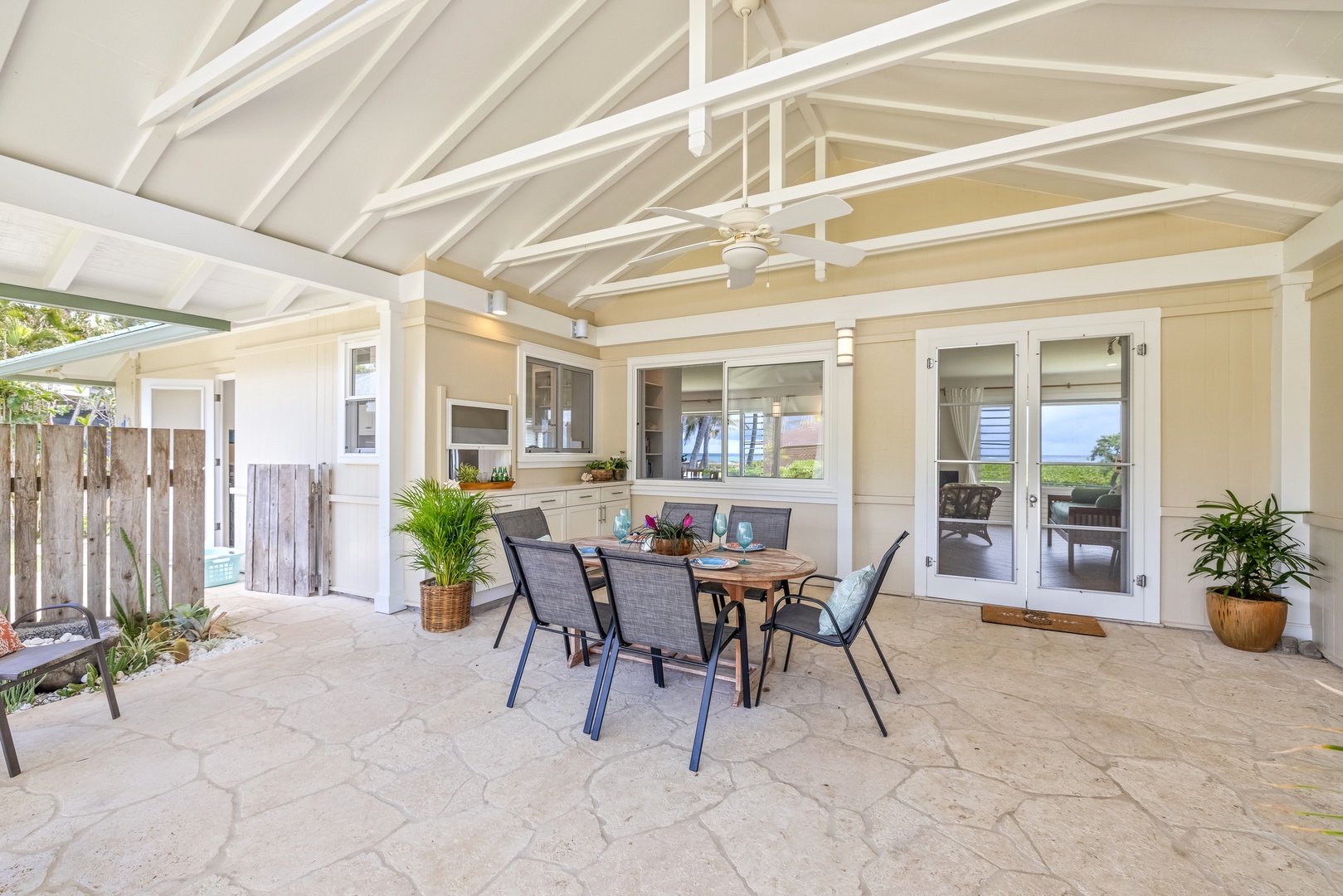 Kailua Vacation Rentals, Hale Moana Lanikai - This spacious lanai merges indoor comfort with outdoor allure, offering a dining area that allows for seamless interaction with the kitchen