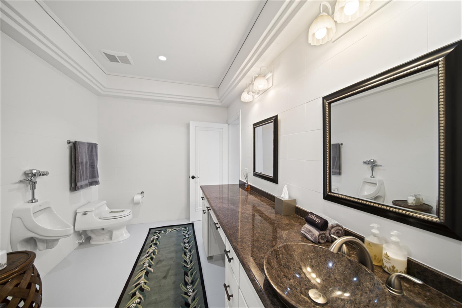 Ninole Vacation Rentals, Waterfalling Estate** - Shared bathroom with ample vanity space.