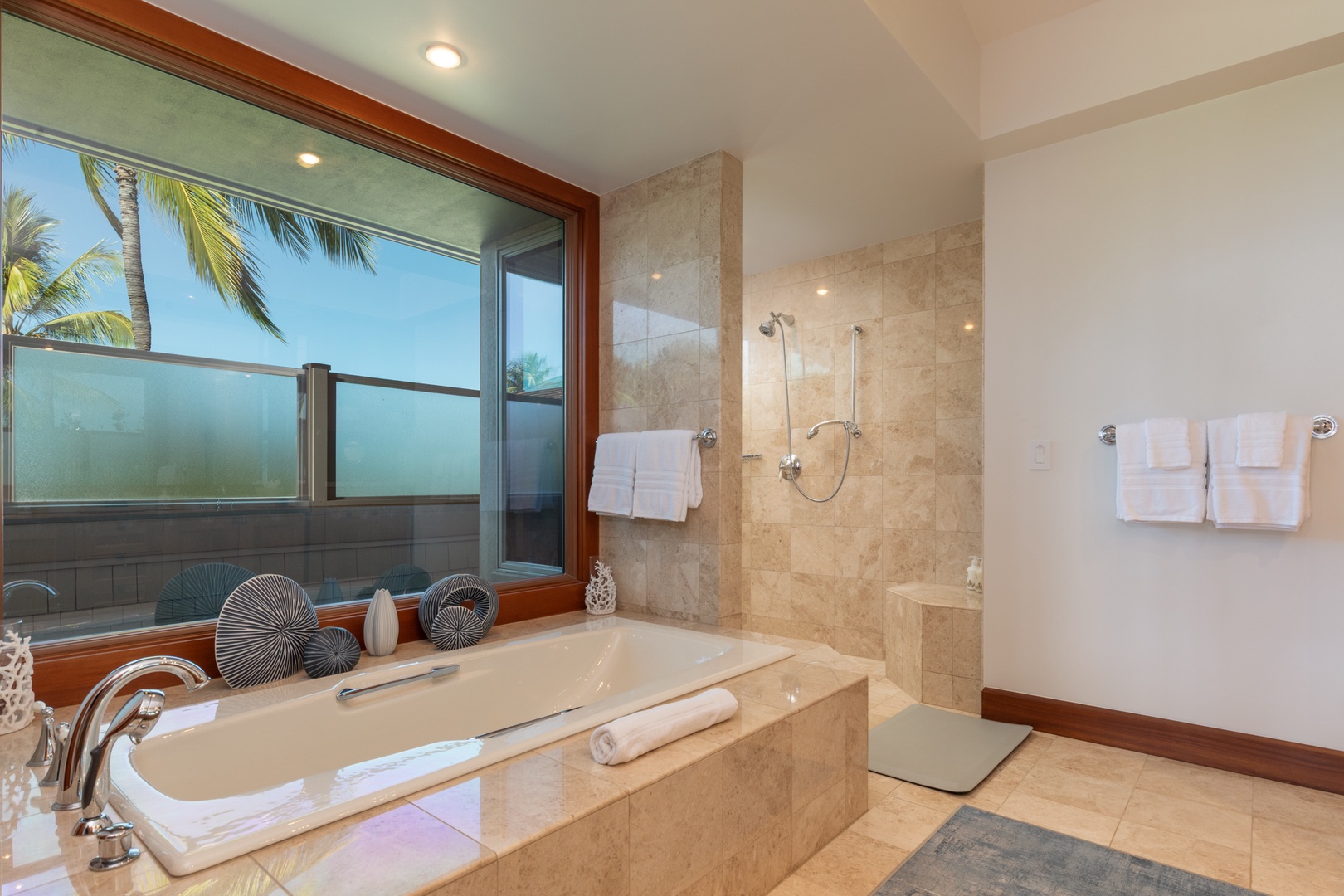 Kailua Kona Vacation Rentals, 3BD Waiulu Villa (111D) at Hualalai Resort - Unwind in your luxurious bathroom featuring a deep soaking tub and spacious shower, with tropical views.