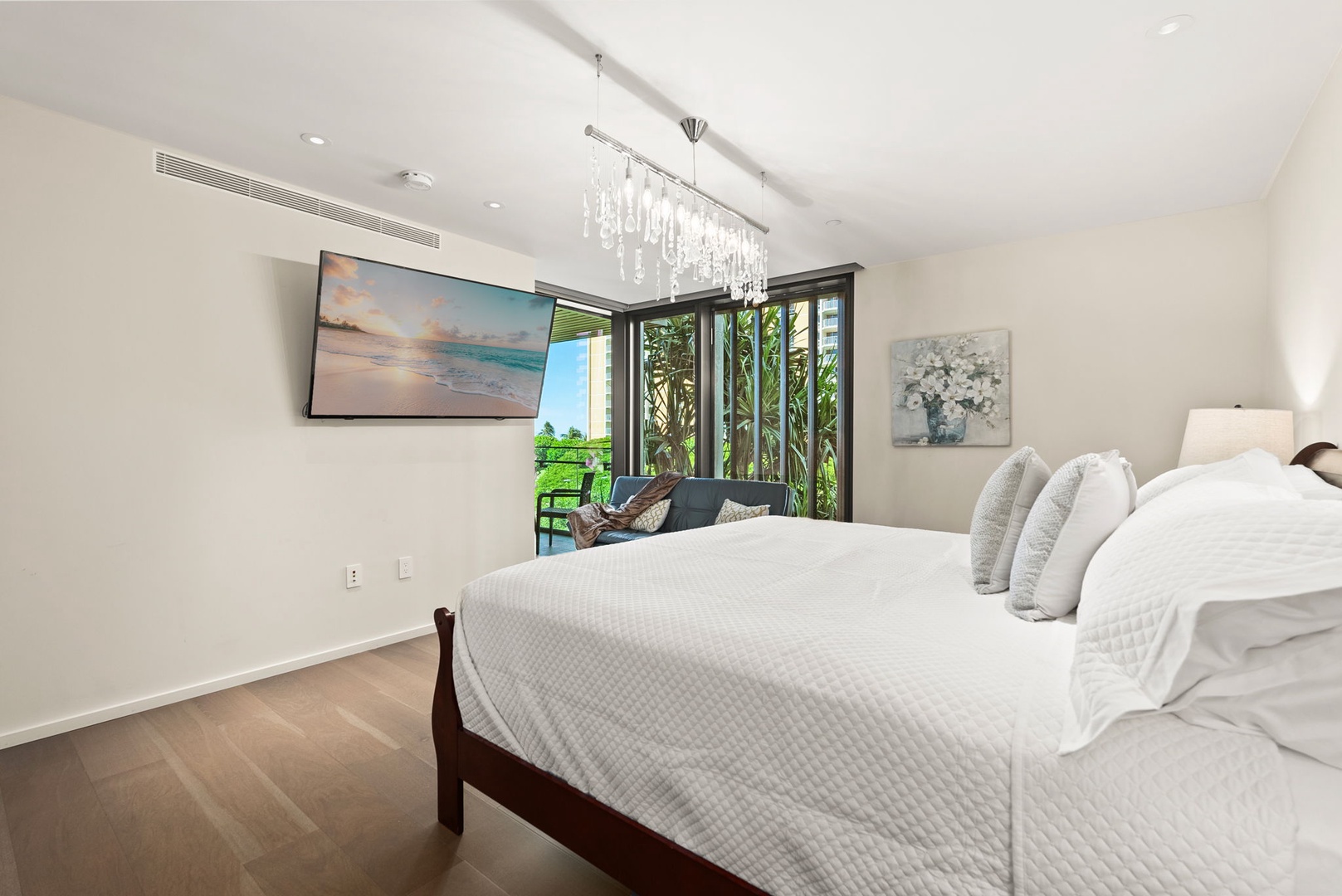 Honolulu Vacation Rentals, Park Lane Getaway - Spacious primary suite with soft lighting, king-sized bed and serene decor for ultimate relaxation.