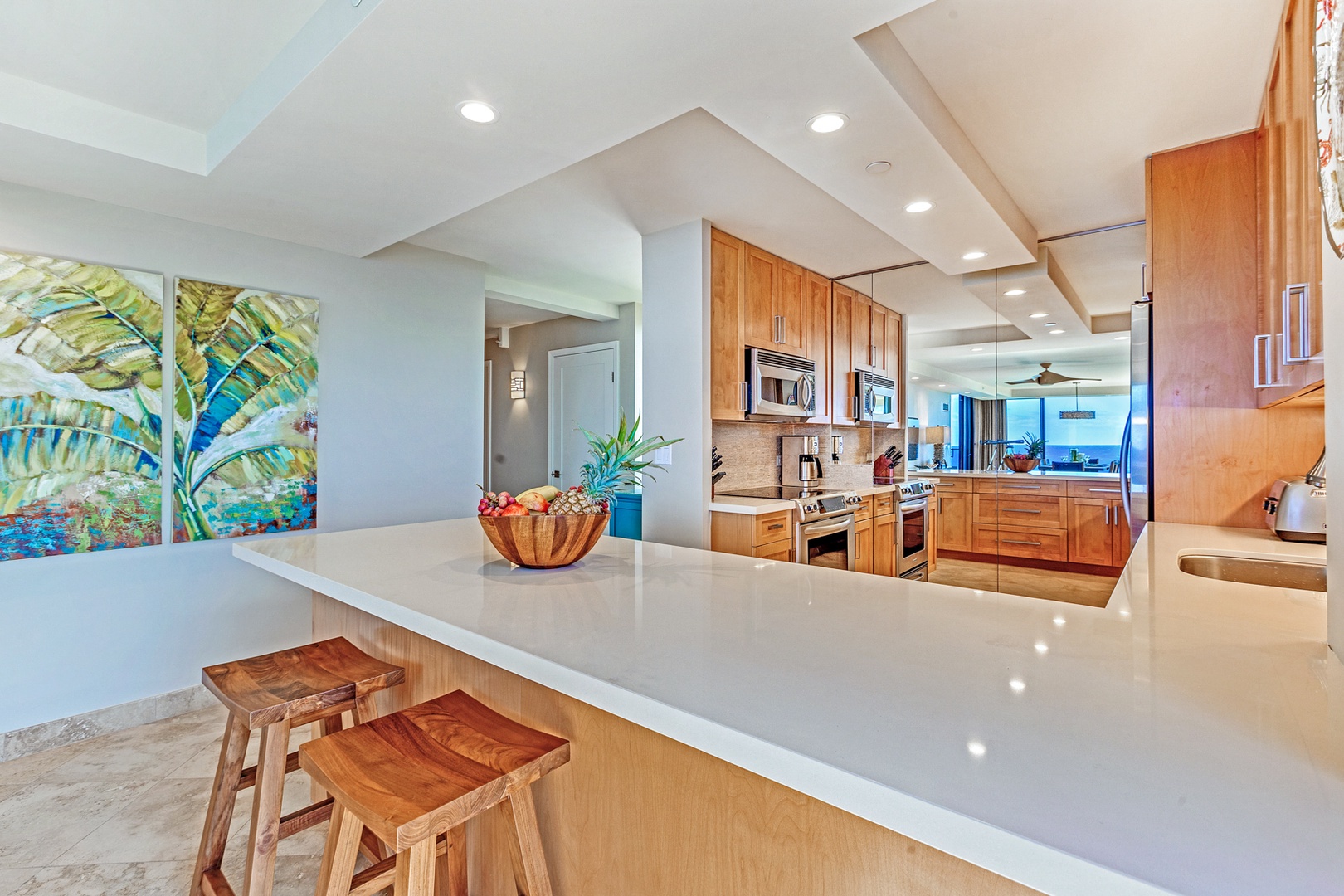 Lahaina Vacation Rentals, Mahana 1119 - The kitchen bar with seating for two, perfect for quick meals and entertainment.