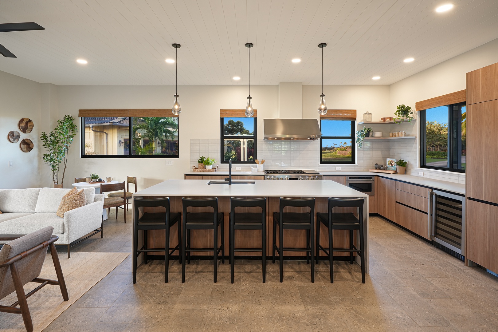 Koloa Vacation Rentals, Ka Hui Ana at Kukuiula - Chef's kitchen with sleek design and seating for five for memorable meals.