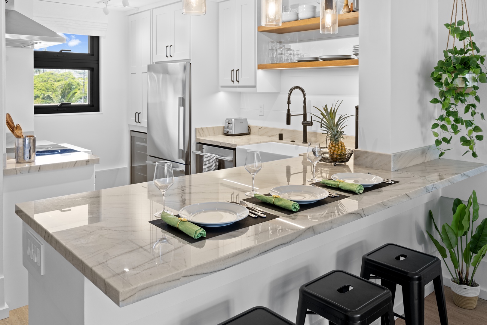 Honolulu Vacation Rentals, Hale Pono Waikiki - Prepare and enjoy meals in this modern kitchen, featuring a spacious island and state-of-the-art appliances.