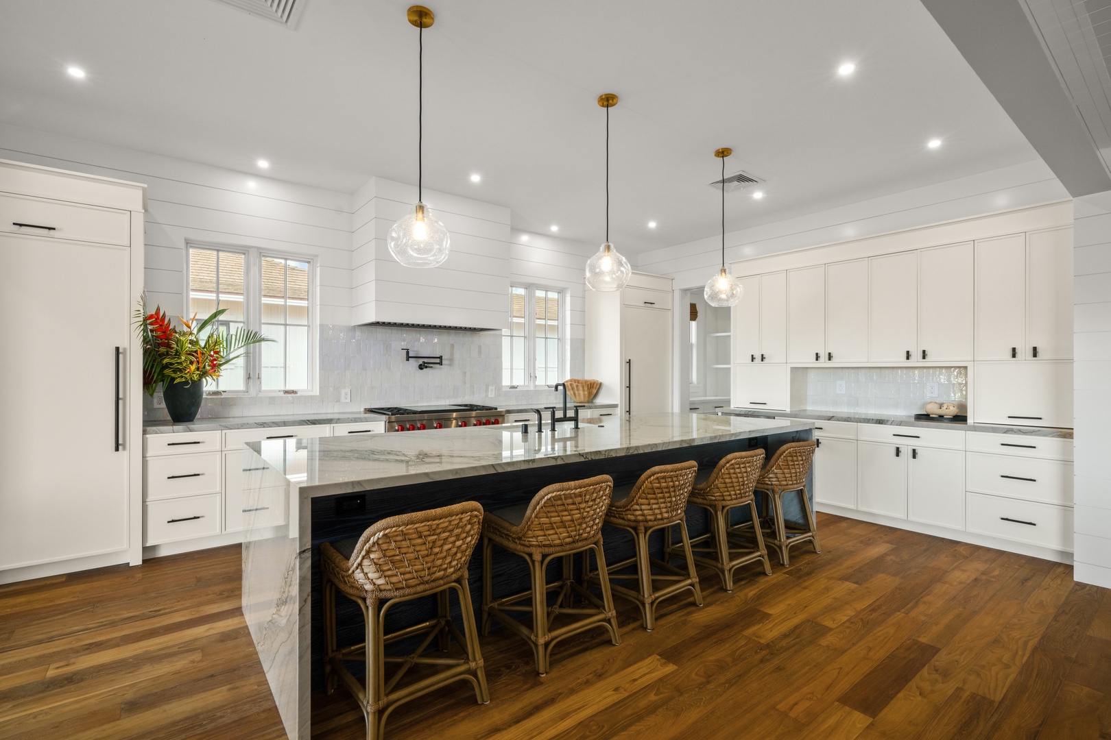 Koloa Vacation Rentals, Makani Kai - White cabinets, woven stools, and counter space that never runs out.