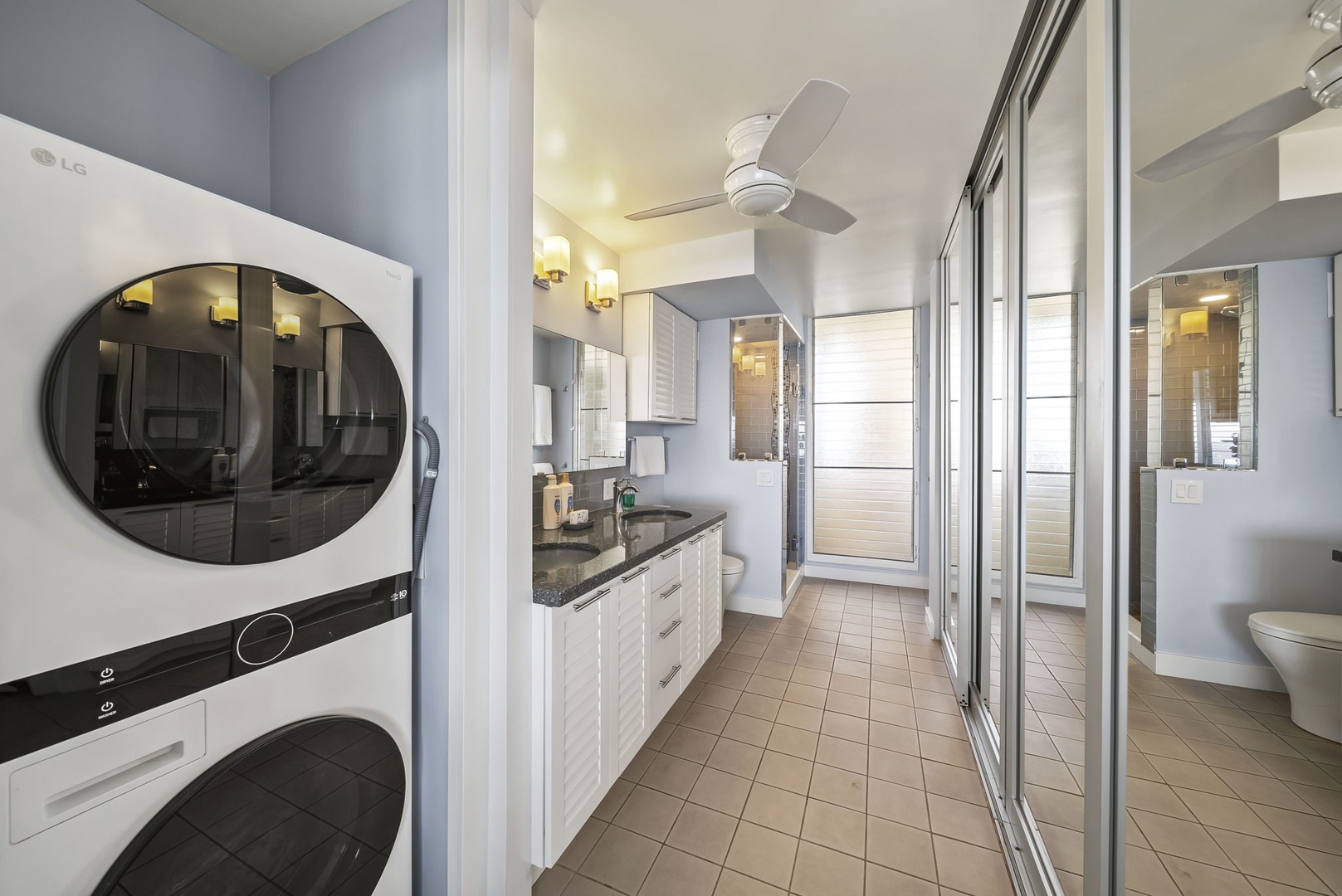Honolulu Vacation Rentals, Kaimana Tides at Colony Surf - Spacious bathroom with modern amenities and in-unit washer/dryer for your convenience.
