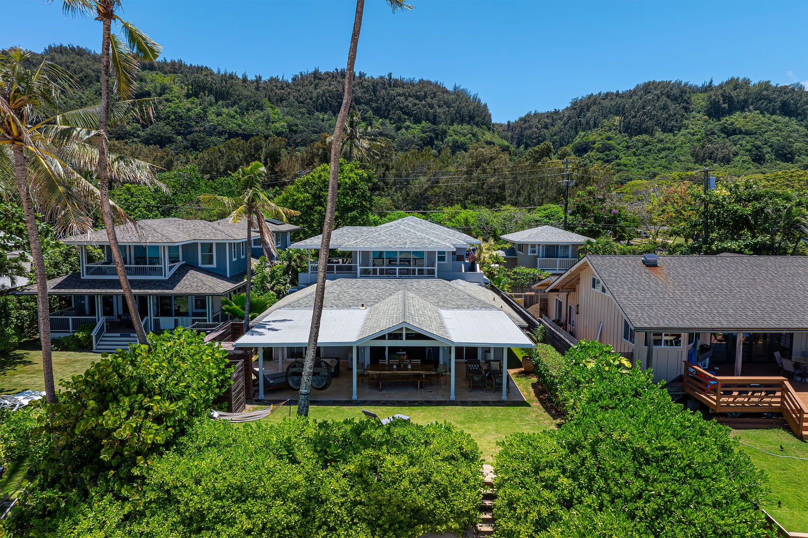 Haleiwa Vacation Rentals, Hale Nalu (Lower Level) - This aerial view shows the home's proximity to both the beach and lush tropical mountains.