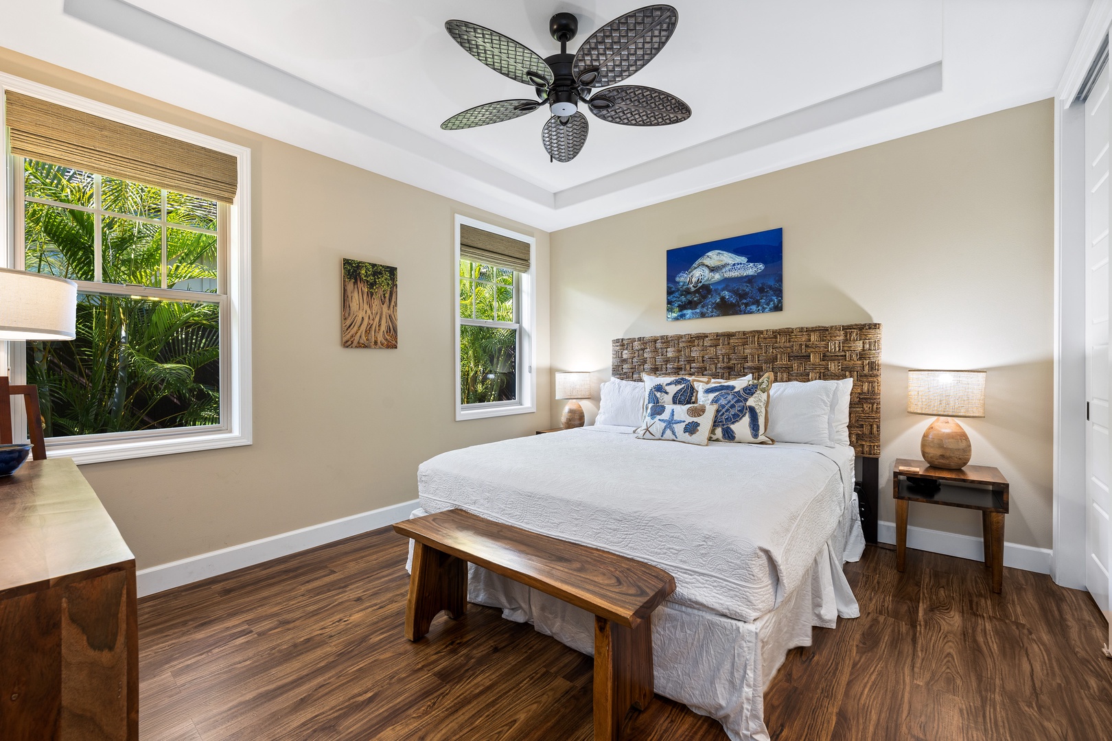 Kailua Kona Vacation Rentals, Kona Blue Vacations Holua Kai - Rest easy in the first guest suite at Kona Blue Vacations Holua Kai, featuring a king bed and ceiling fan.
