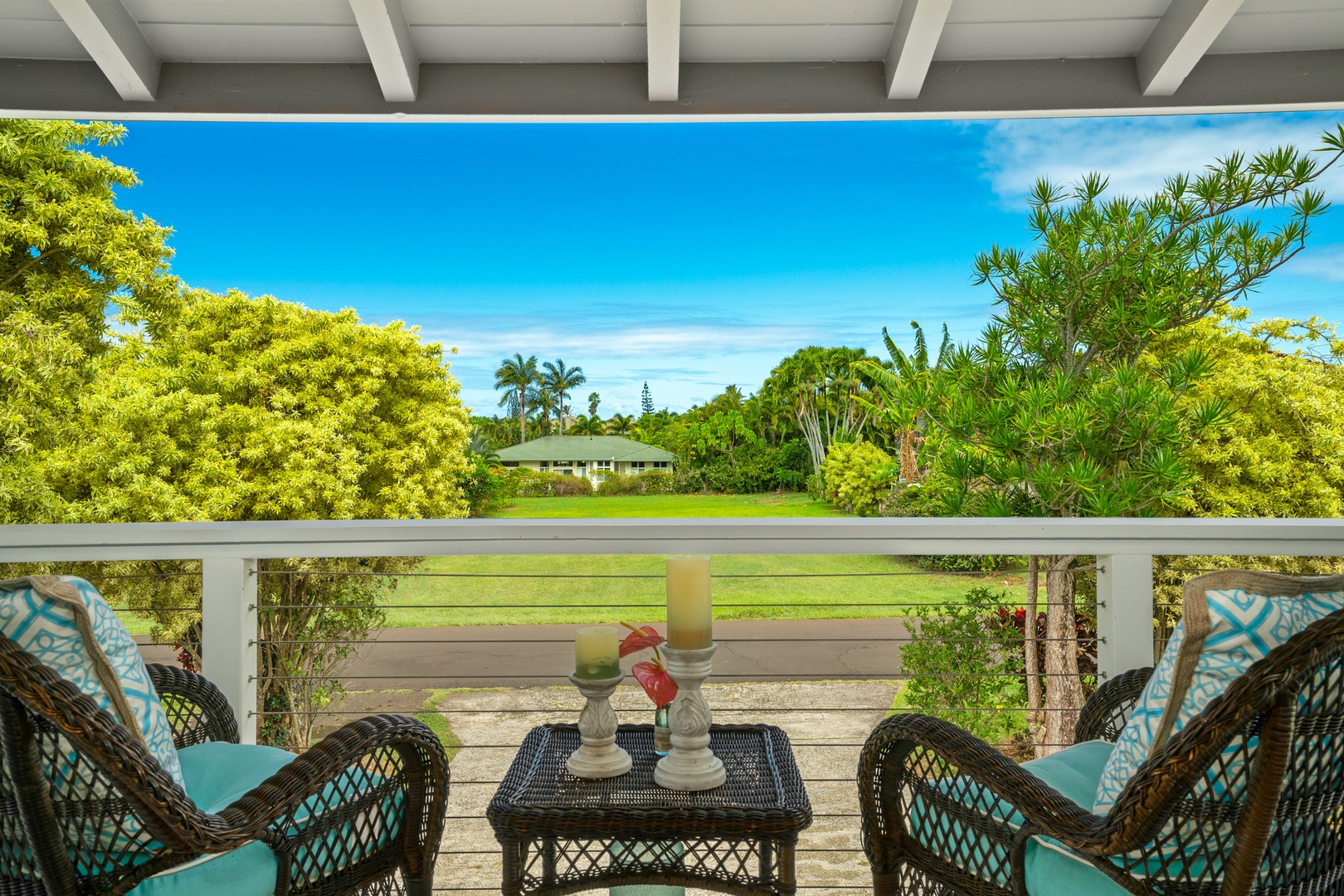 Princeville Vacation Rentals, Ola Hou - Main House - Enjoy outdoor dining with a view of the garden, perfect for quiet mornings or sunset evenings.