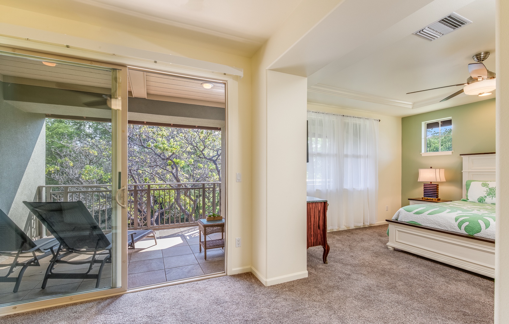 Kamuela Vacation Rentals, Mauna Lani Fairways #204 - Enjoy peaceful mornings or quiet evenings with access to a private lanai just off your bedroom, surrounded by treetops.