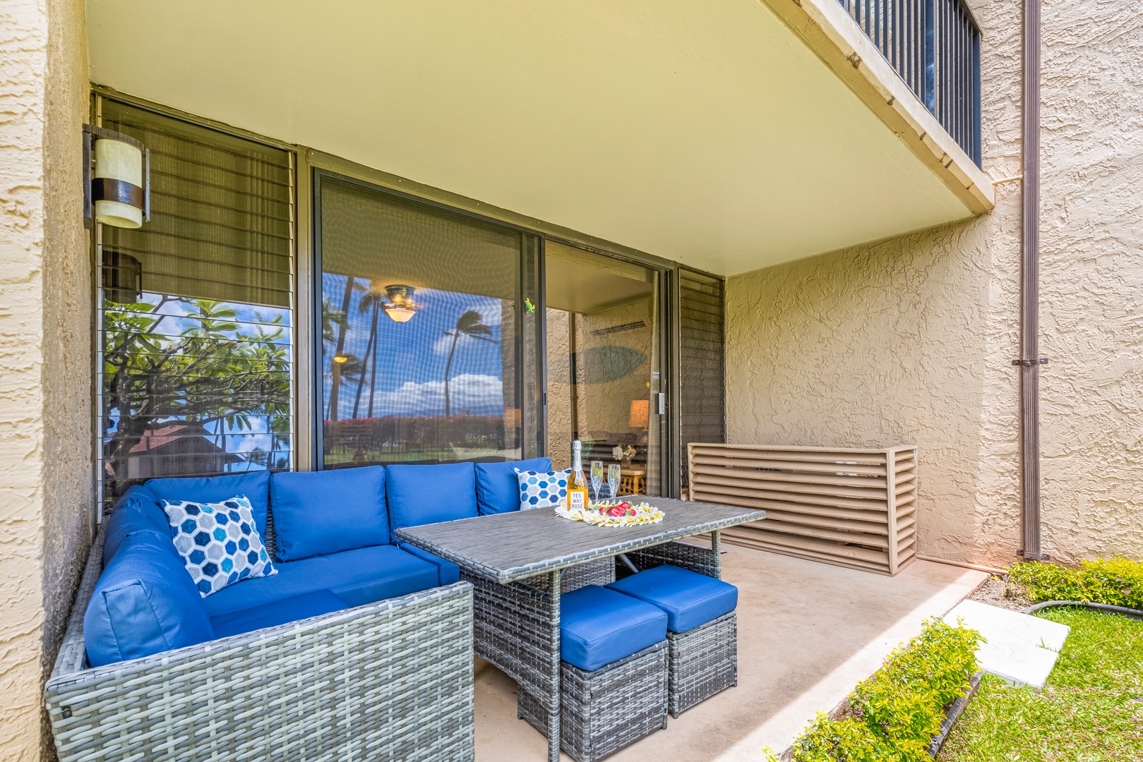 Lahaina Vacation Rentals, Papakea K-105 - The lanai provides a comfortable seating area with direct access to the living room, creating an inviting space to relax and enjoy the tropical breezes.