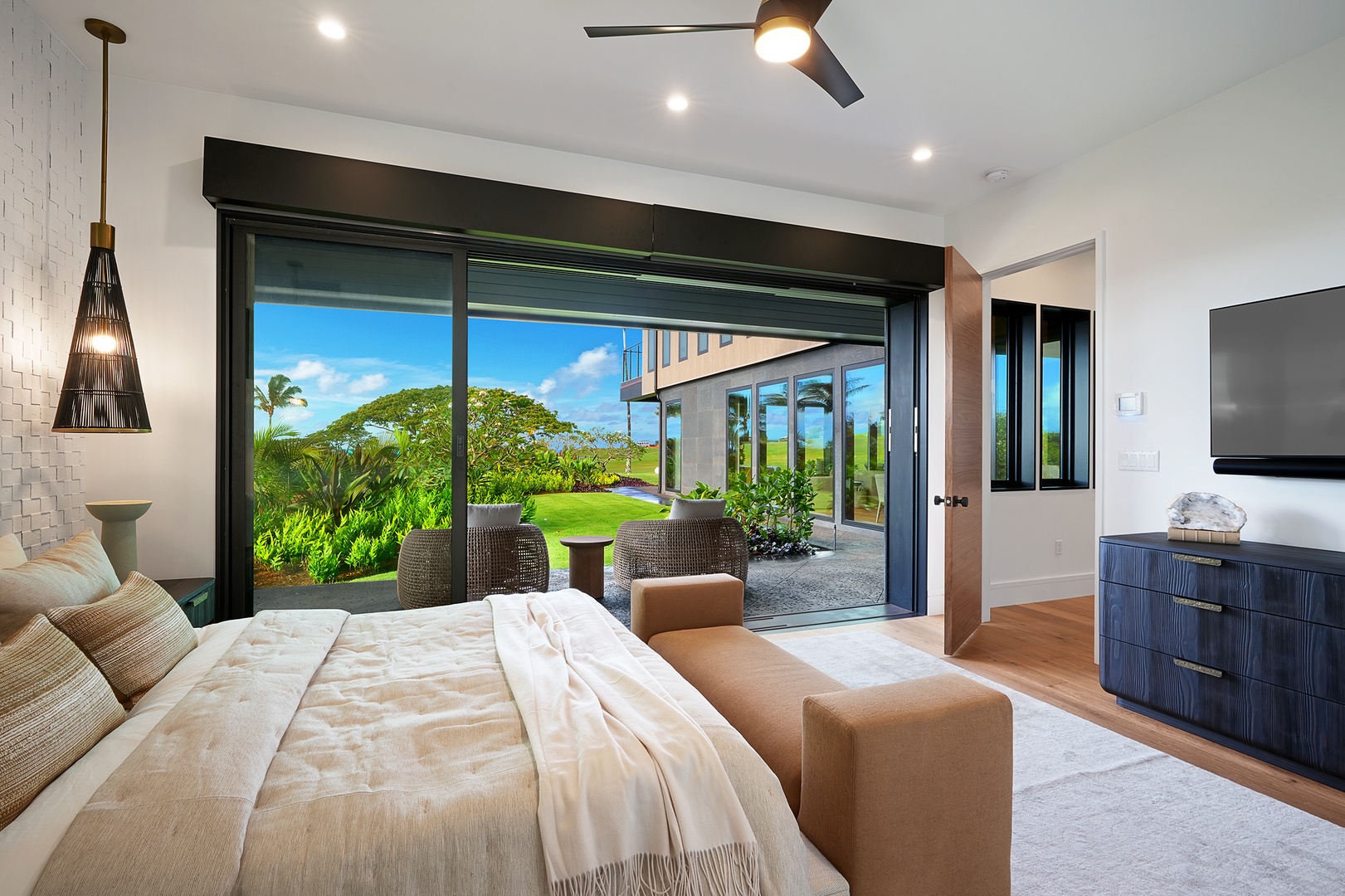 Koloa Vacation Rentals, Hale O Ka Nene - Retreat to the guest suite with a cozy king bed framed by lush greenery and whispering palms just beyond your window.