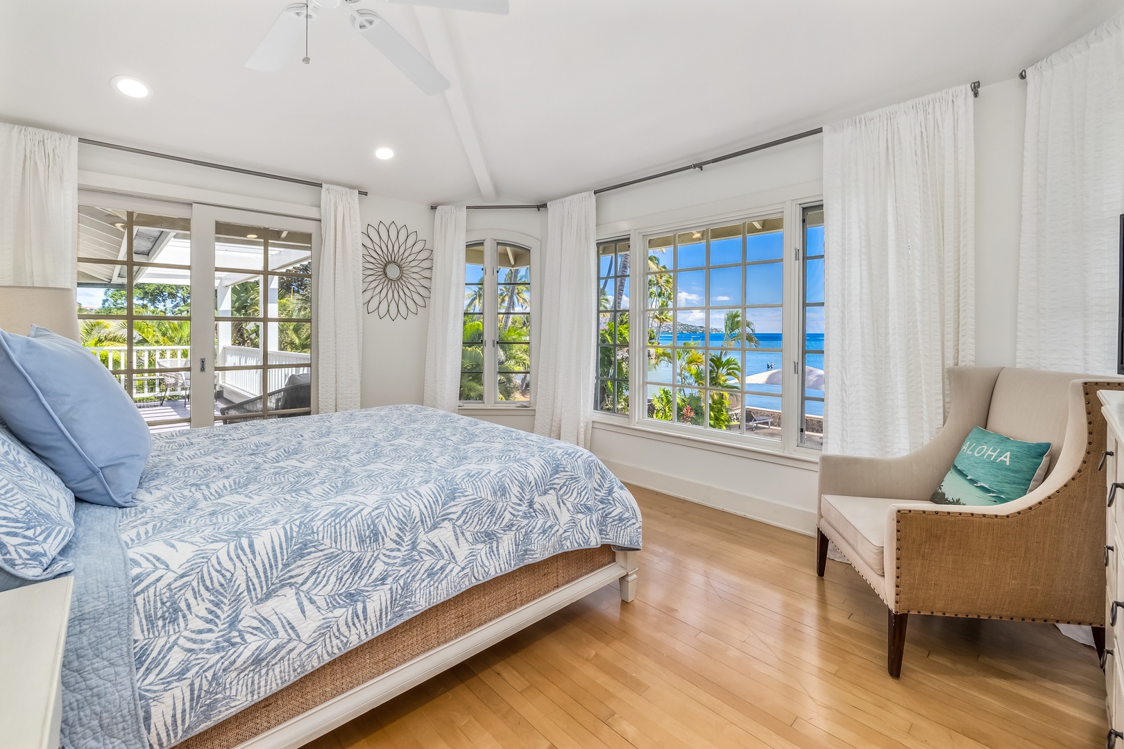 Honolulu Vacation Rentals, Moana Lani - Primary Bedroom 2 with king bed, sofa bed, and expansive ocean views.