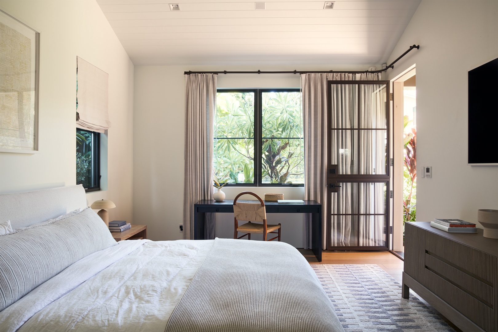 Honolulu Vacation Rentals, Diamond Head Hillside Estate** - Wake to tropical garden views and gentle island light in this serene bedroom retreat, thoughtfully designed for rest and relaxation.