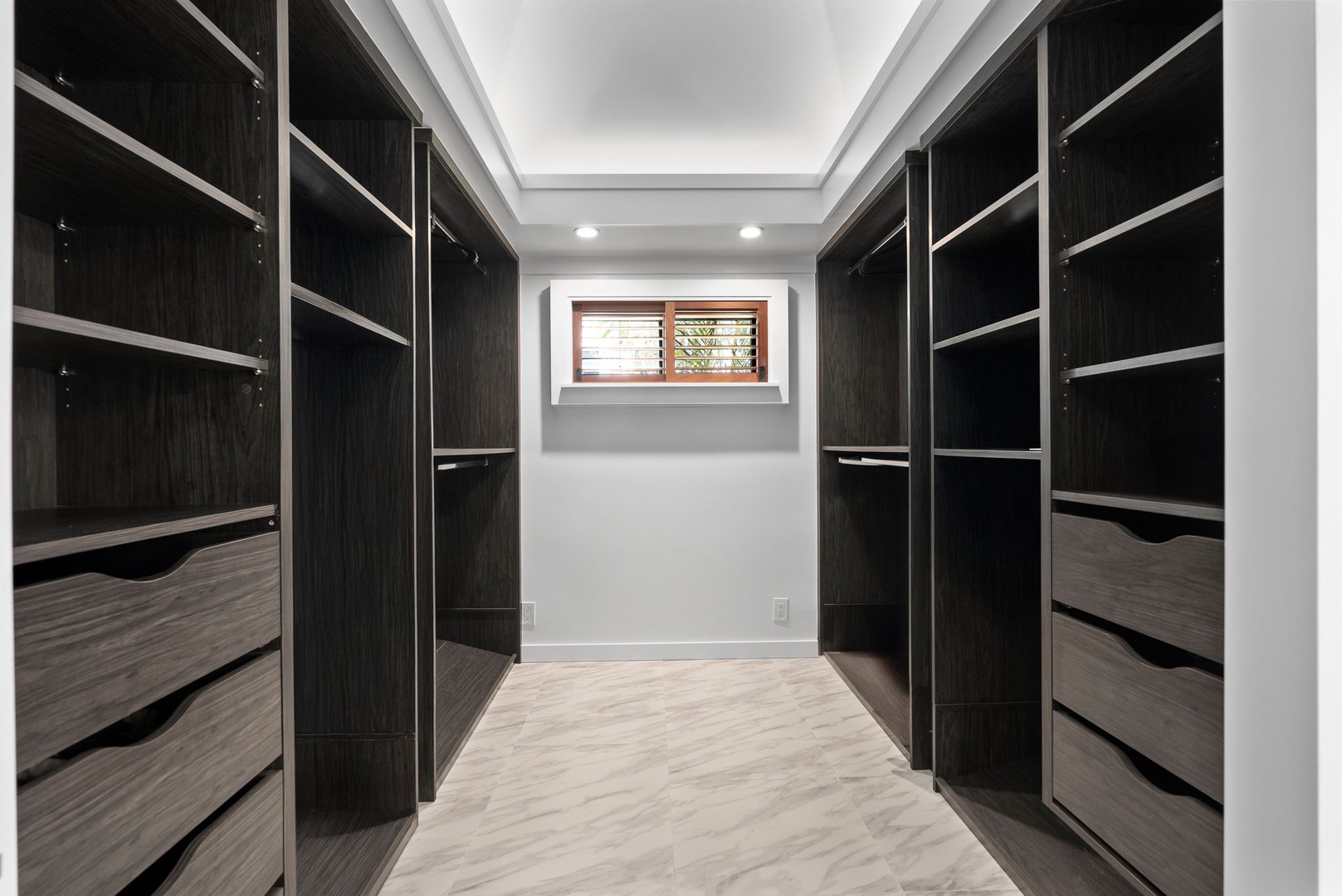 Honolulu Vacation Rentals, Honolulu Lagoonfront Villa - Stay organized in style—spacious walk-in closet with custom cabinetry for extended stays at Honolulu Lagoonfront Villa.