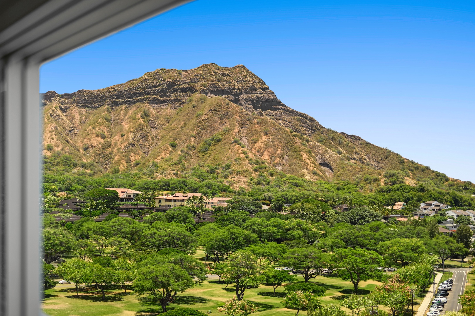 Honolulu Vacation Rentals, Kaimana Shores Getaway - Diamond Head rises above lush parkland, offering one of Honolulu's most iconic landscapes just moments from your stay.