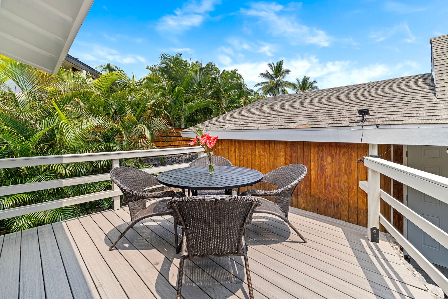 Kailua Kona Vacation Rentals, Manukai Hale - Pull a chair up to the deck table where the day winds down over the golf course.