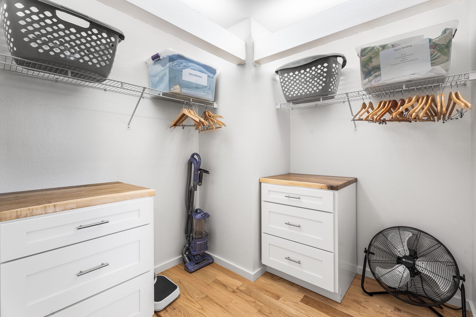 Kailua Kona Vacation Rentals, Kanaloa at Kona 701 - Your spacious walk-in closet offers ample storage with built-in shelving, wooden hangers, and organized drawers for all your belongings.