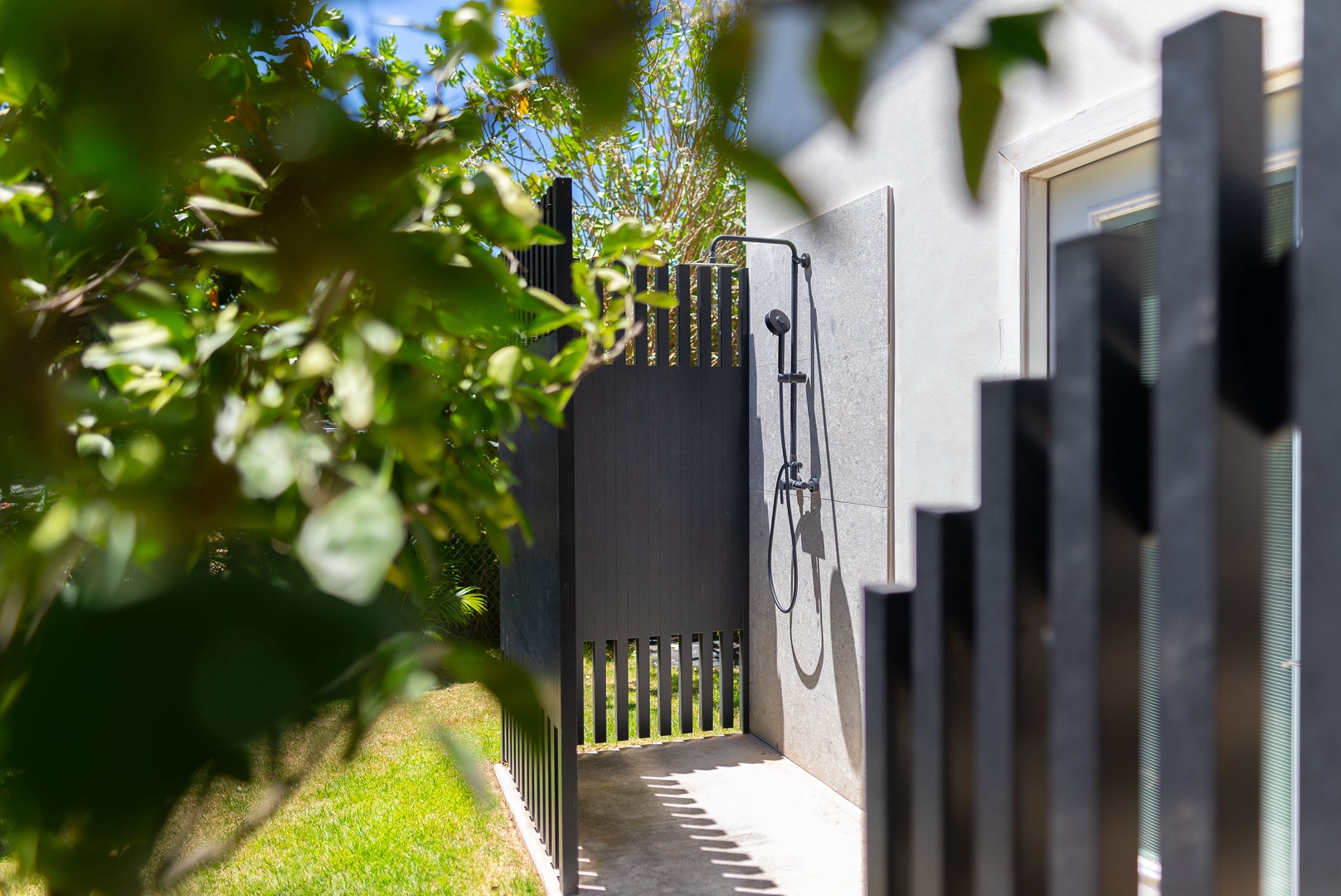 Haleiwa Vacation Rentals, Sunset Beach Island Retreat - This sleek outdoor shower provides a refreshing retreat after a day in the sun