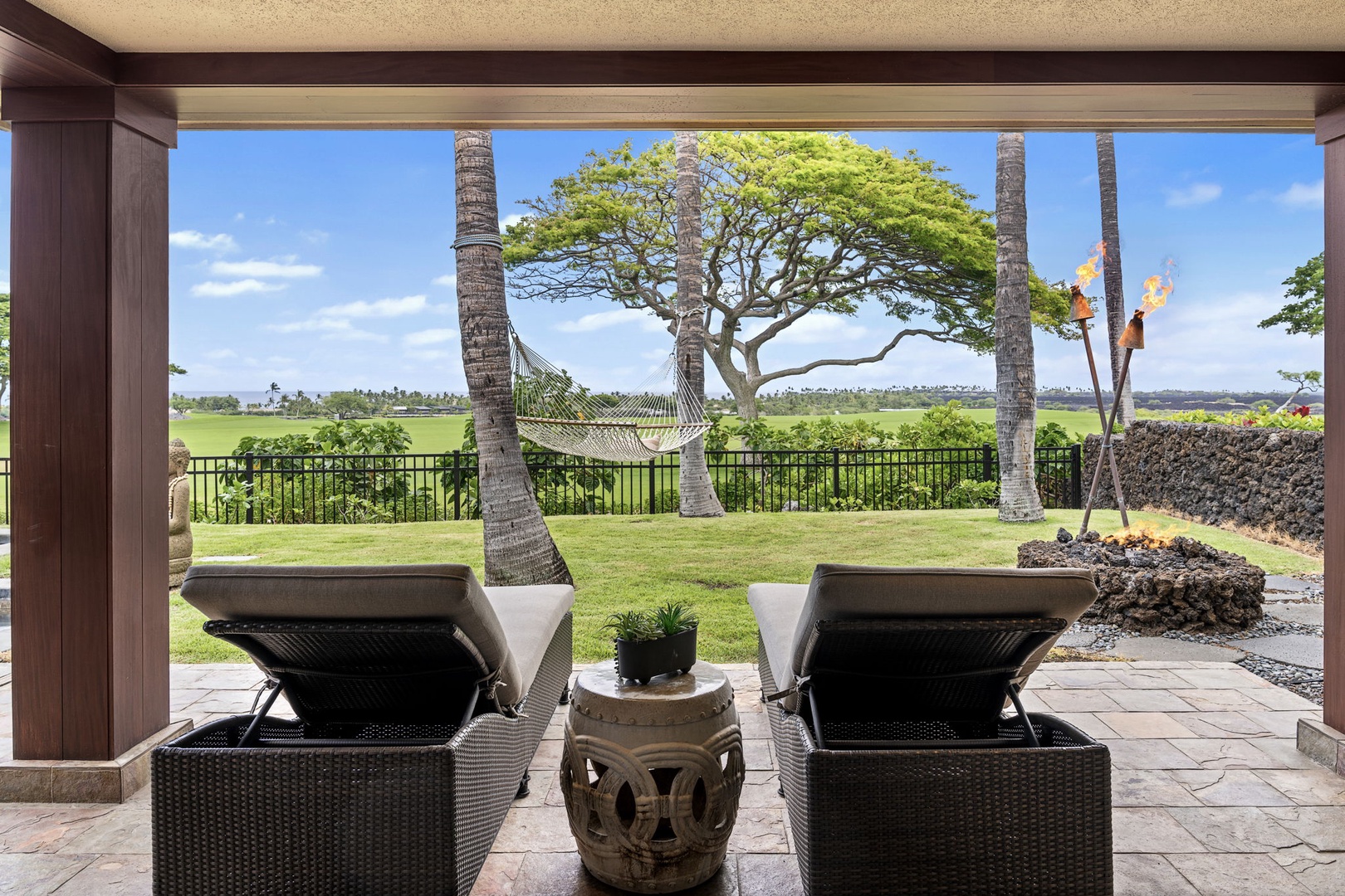 Kailua Kona Vacation Rentals, 3BD Pakui Street Estate (149) at Hualalai Resort - Two loungers, a monkeypod tree, and the fairway wide open just off the primary suite.