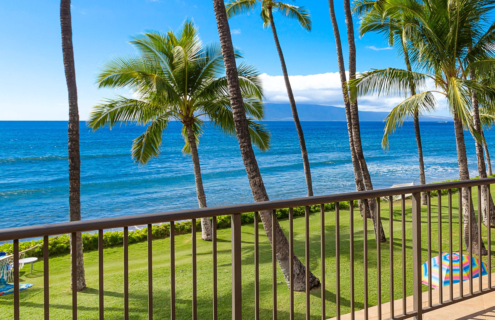 Lahaina Vacation Rentals, Puamana 240-3 - Swaying palms and ocean views create a tranquil paradise outside your door.