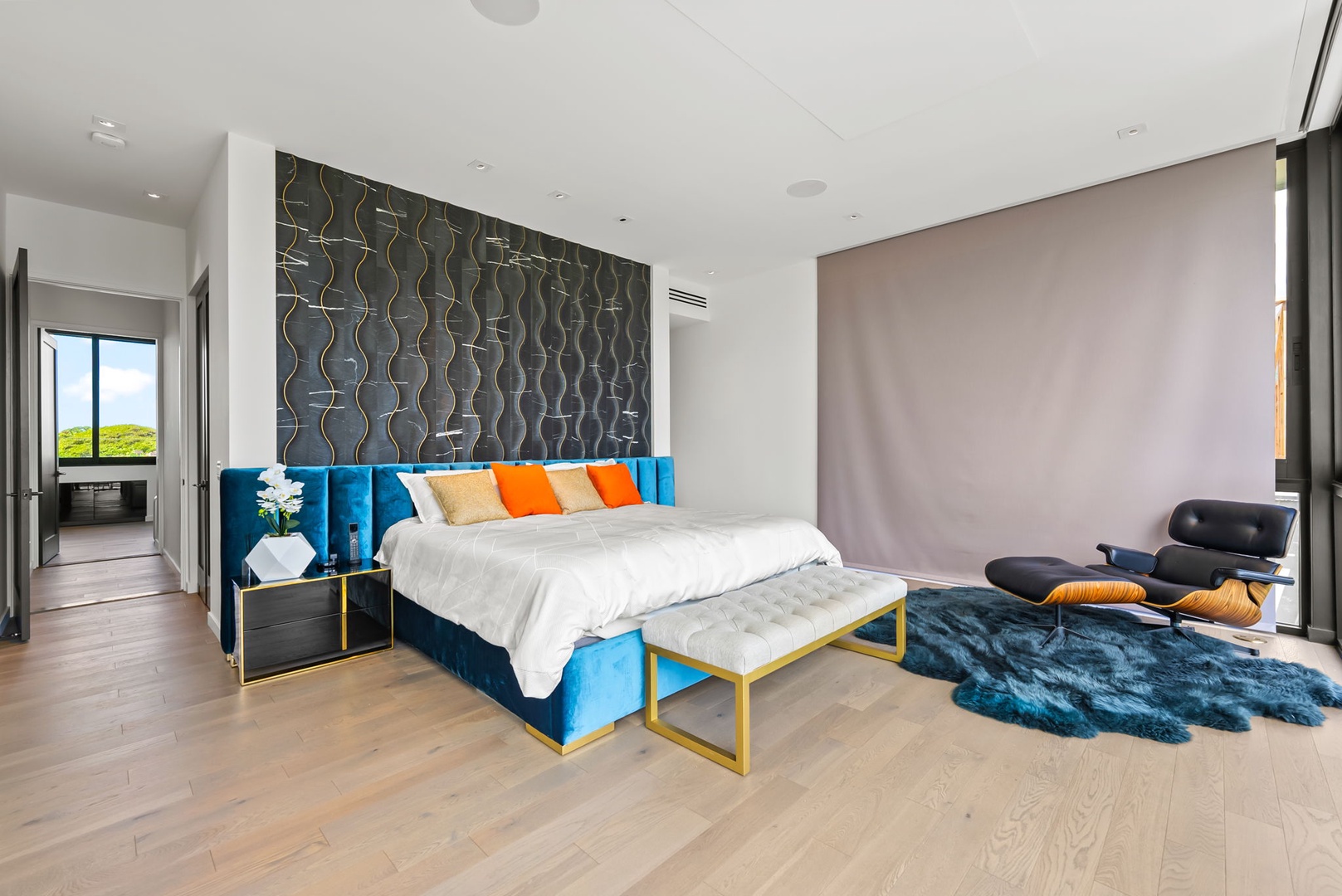 Honolulu Vacation Rentals, Ocean Villa Emilie - This chic guest suite features designer wall treatments, layered textiles, and generous glass doors opening to island air.
