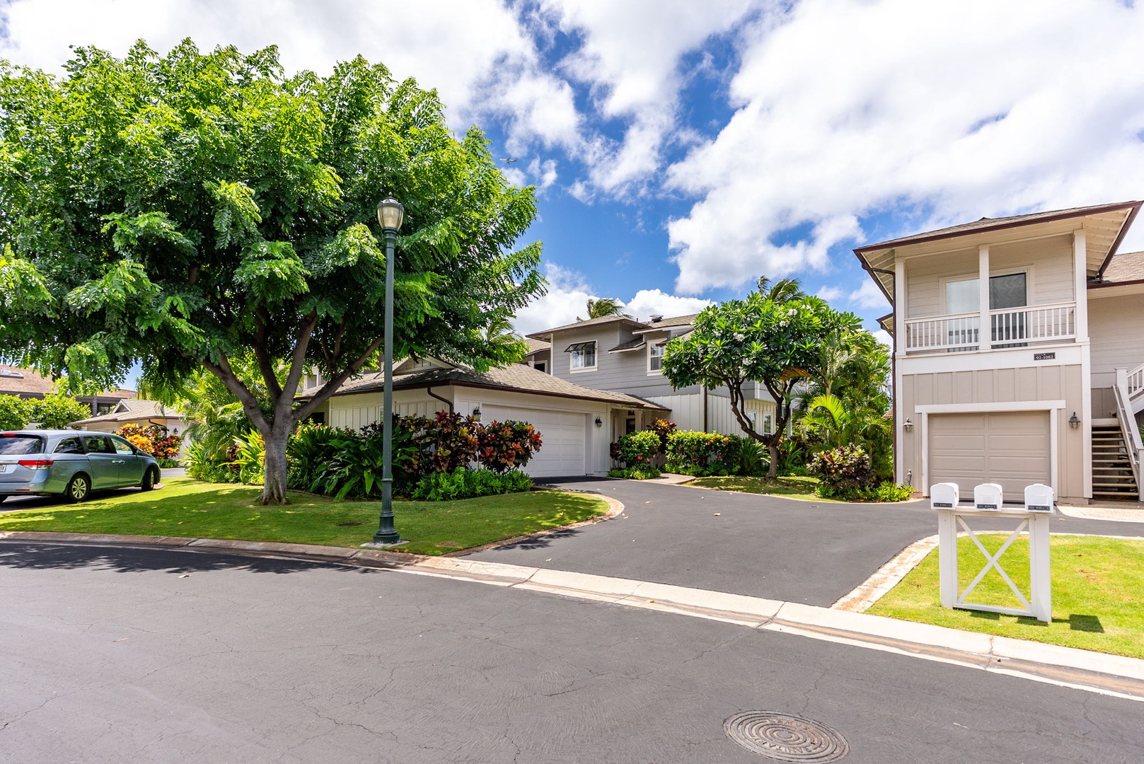 Kapolei Vacation Rentals, Coconut Plantation 1080-4 - Townhomes lined along the community drive, low-slung and residential.
