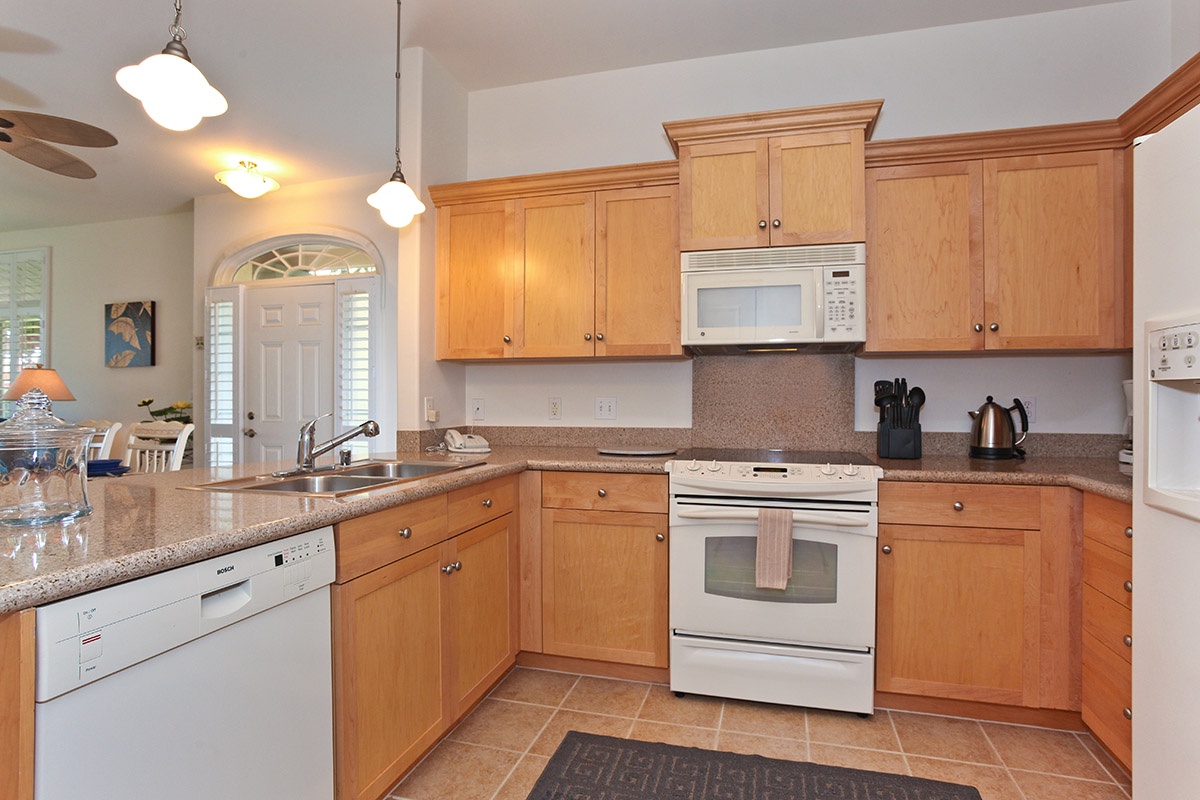 Kapolei Vacation Rentals, Kai Lani 12D - The bright kitchen features many amenities including a fridge, oven, dishwasher and high ceilings.
