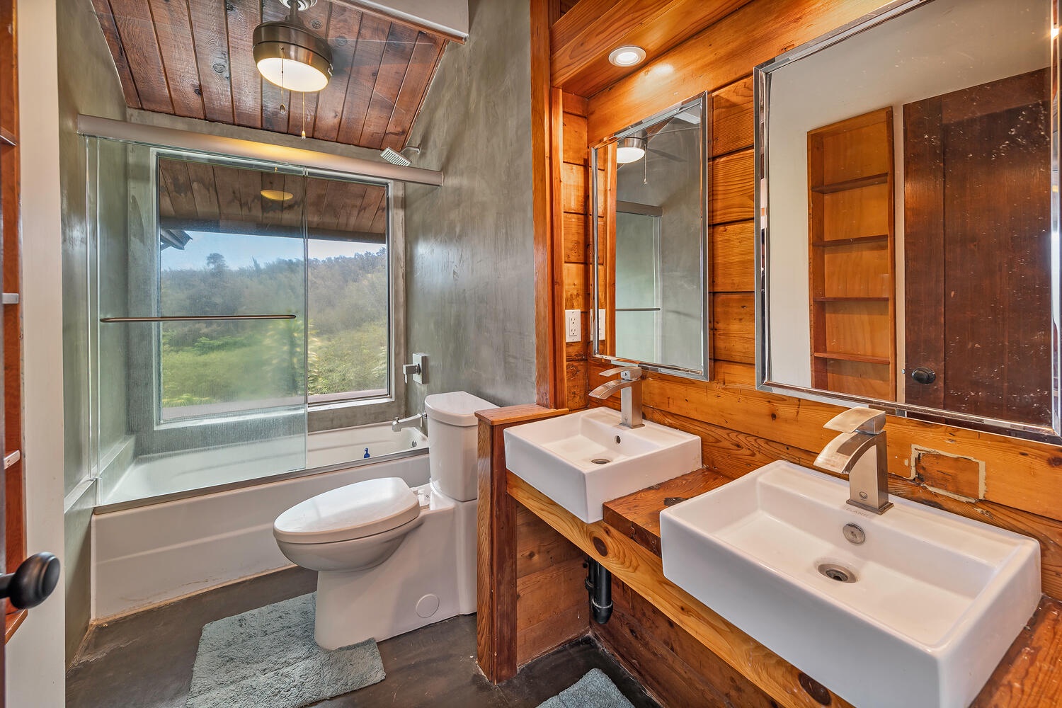 Haleiwa Vacation Rentals, Mele Makana - The upstairs guest bathroom has dual sinks and a shower/tub combo