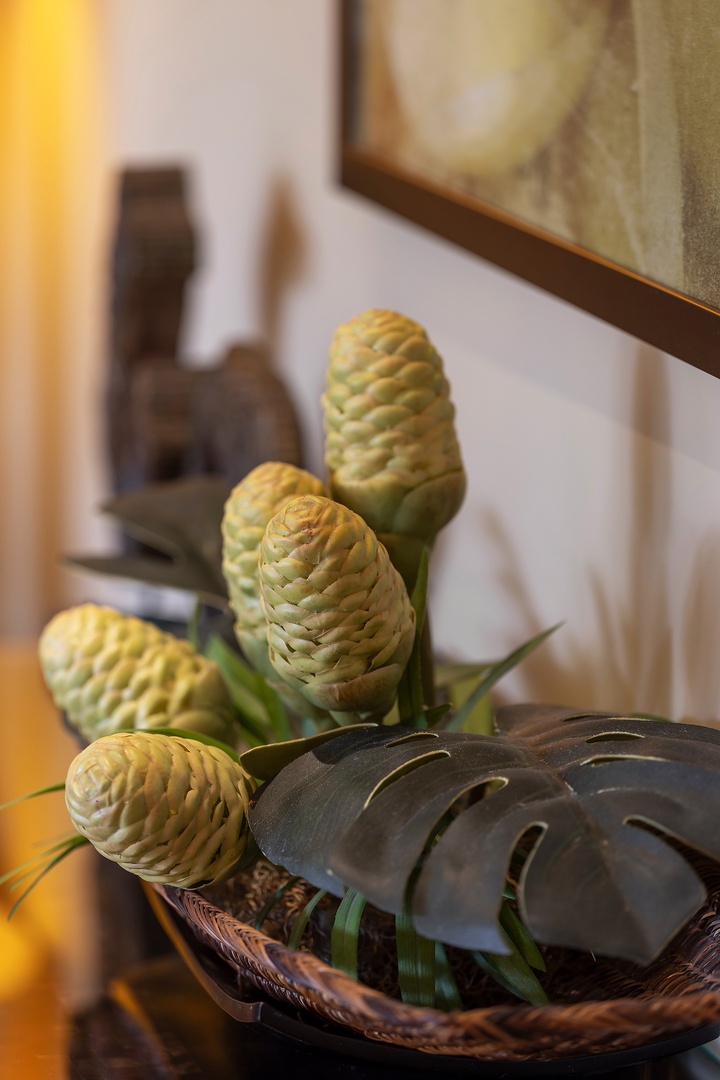 A decorative basket with pinecones and tropical leaves adds a natural, artful touch to your living space.