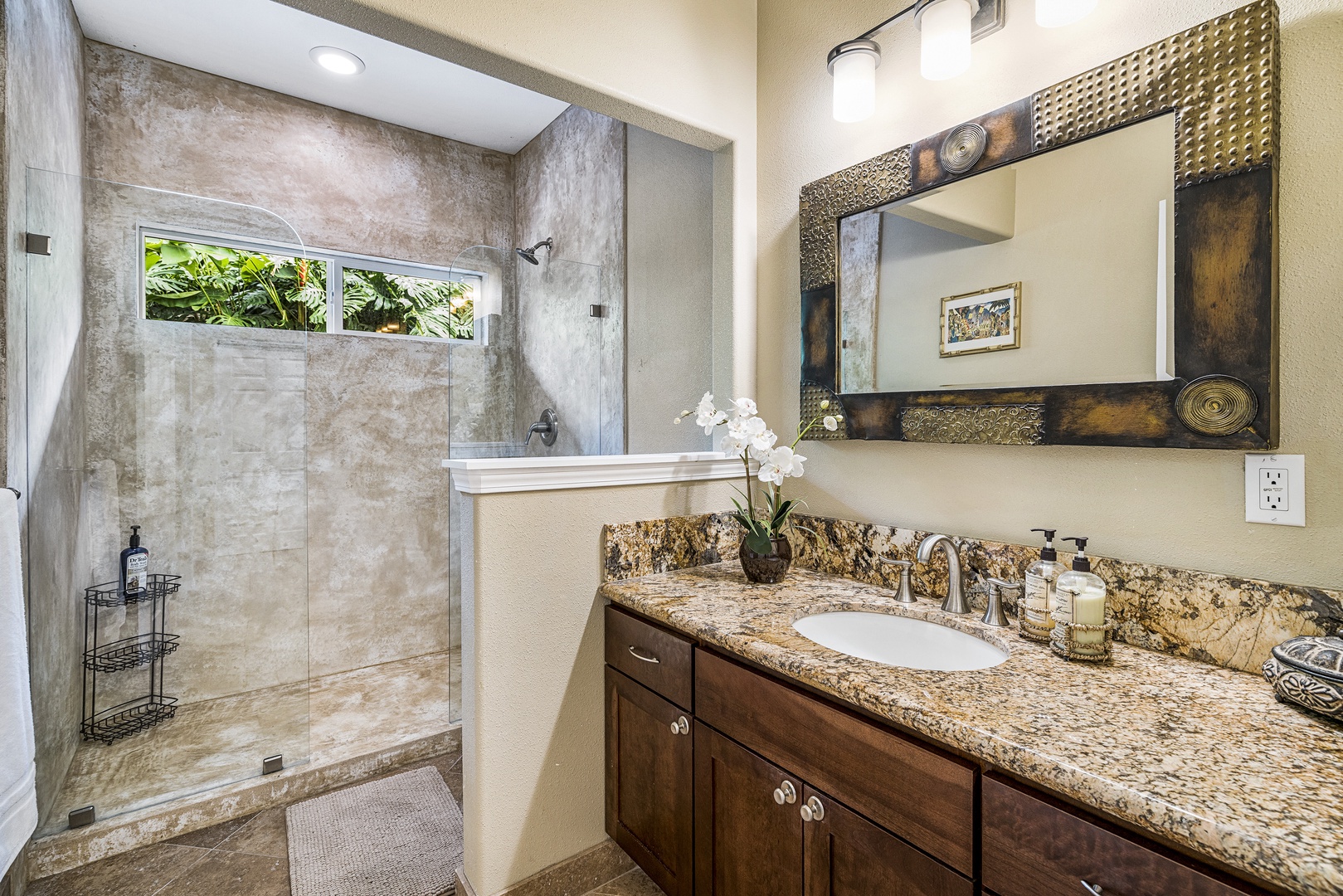 Kailua Kona Vacation Rentals, Sunset Hale - The guest bath includes a walk-in shower, granite vanity, and beautiful tilework for daily comfort.