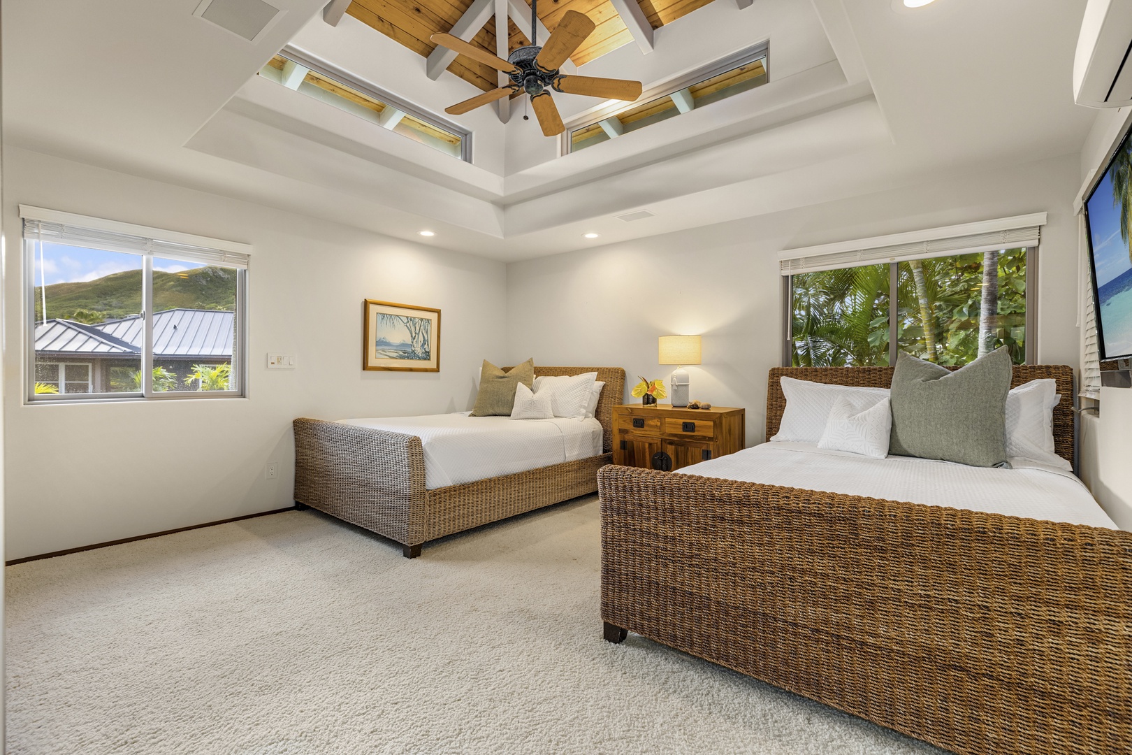 Kailua Vacation Rentals, Mokulua Sunrise - Guest Bedroom 2 is furnished with 2 full beds, with mountain views and an ensuite bath