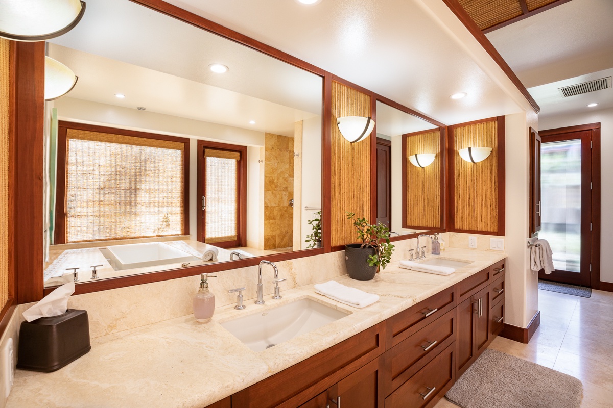 Kamuela Vacation Rentals, Beach Walker at Champion Ridge - The primary bedroom's attached bathroom has a jetted soaking tub—ideal for unwinding after a long day—along with a spacious vanity and a separate walk-in shower.