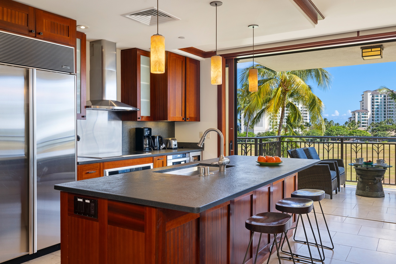 Kapolei Vacation Rentals, Ko Olina Beach Villas B403 - Your fully equipped kitchen opens to tropical views, perfect for preparing meals while enjoying palm trees and ocean breezes.