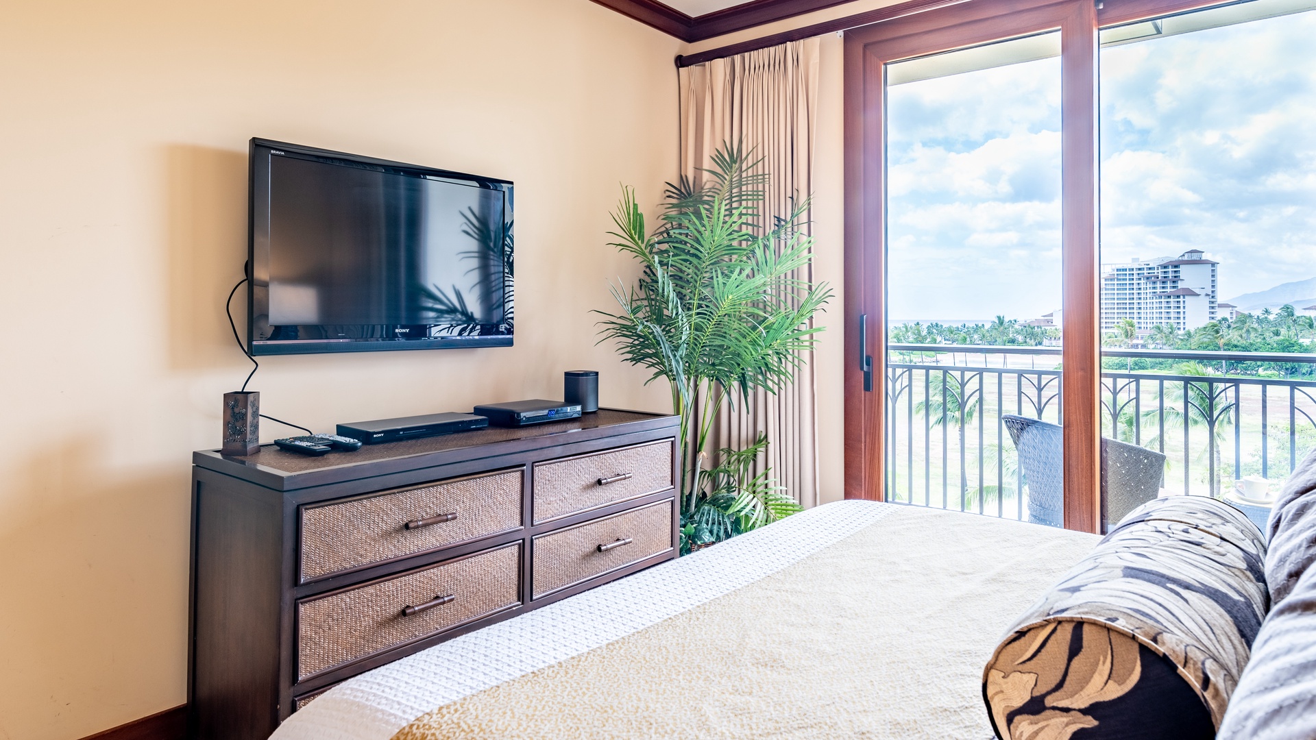 Kapolei Vacation Rentals, Ko Olina Beach Villas B608 - The primary guest bedroom with a TV and ceiling fan.