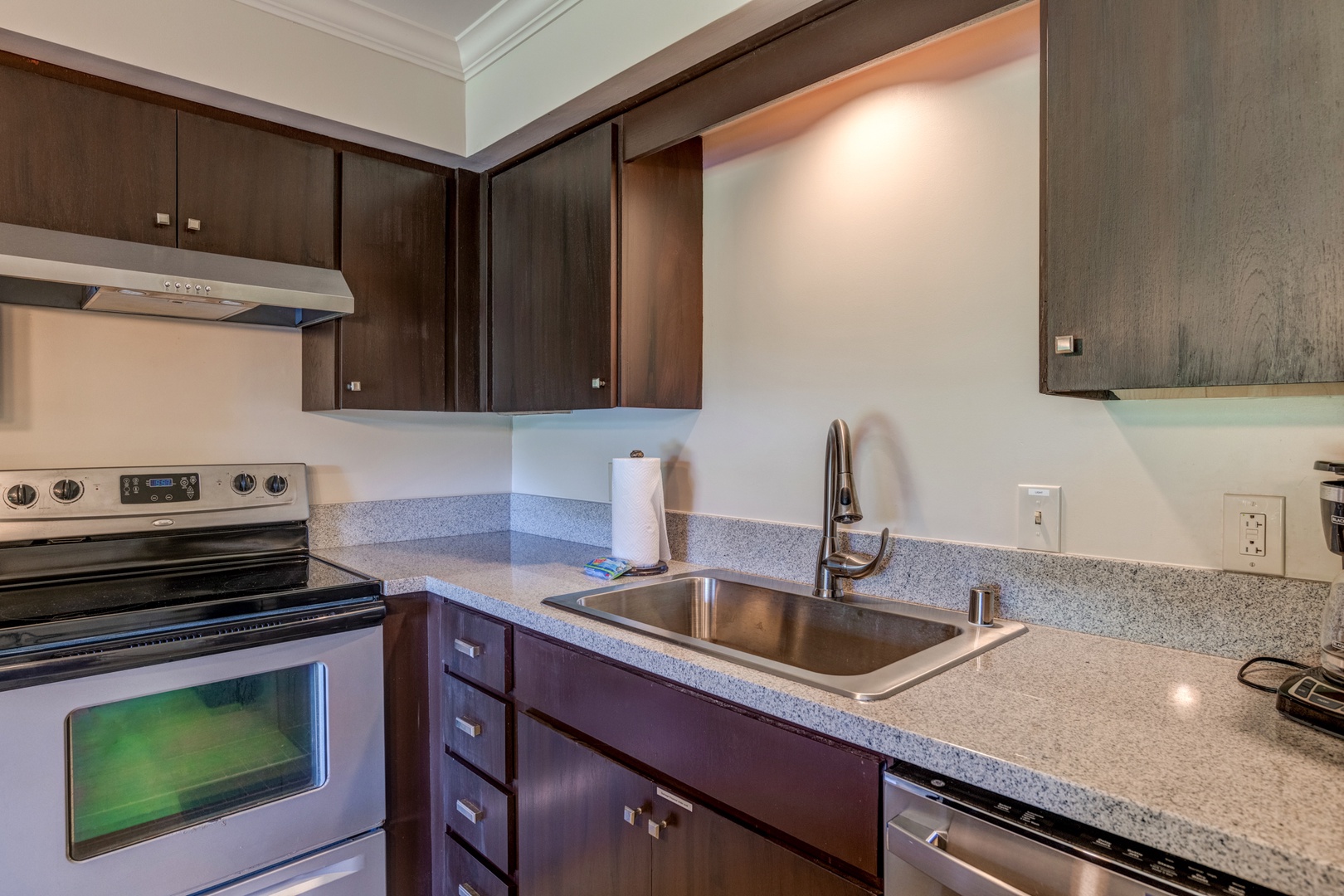 Kihei Vacation Rentals, Koa Resort 1B - Well-equipped kitchen with granite countertops, dual sinks, and stainless steel appliances.