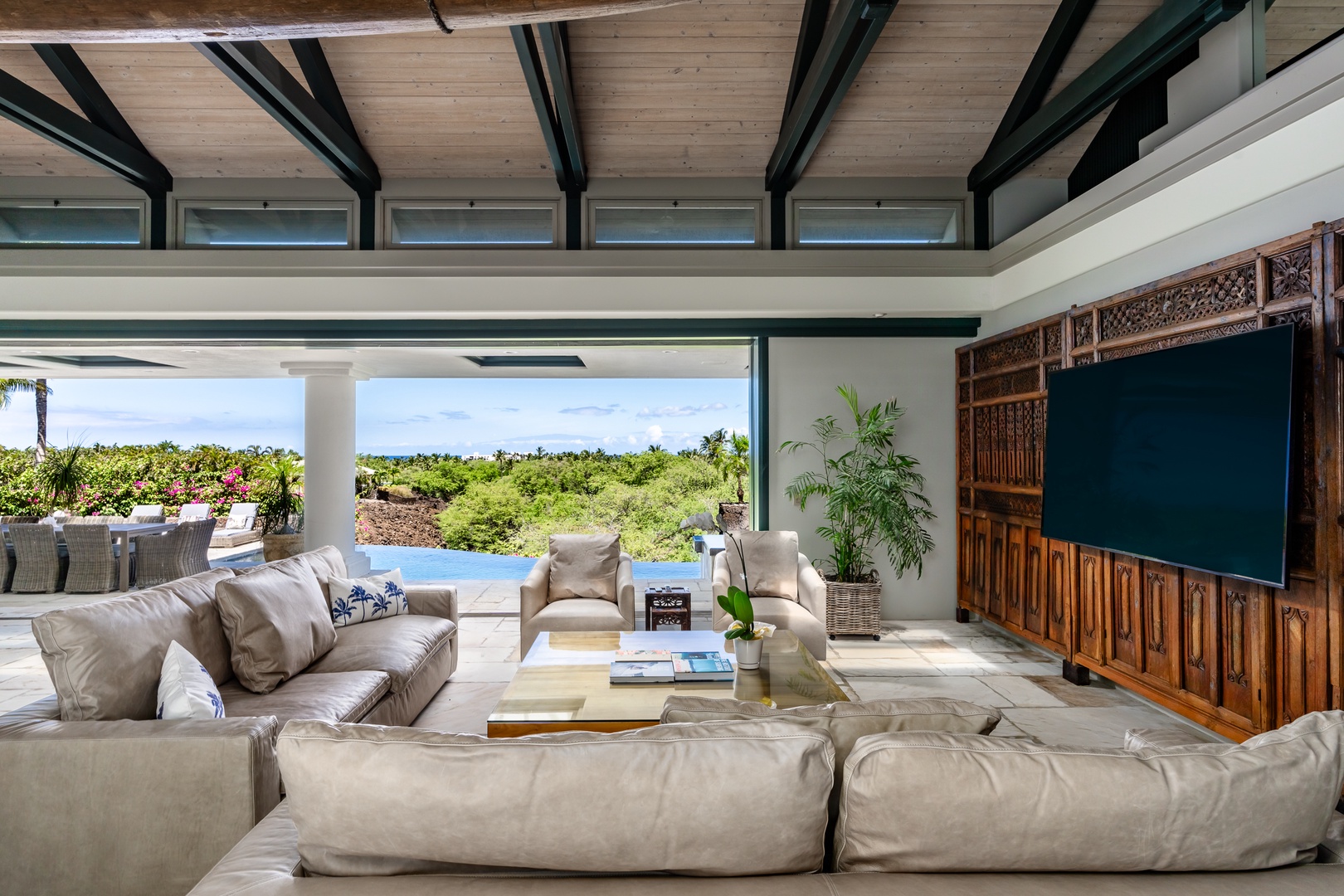 Kamuela Vacation Rentals, Canoe House at Champion Ridge - Comfortable lounge seating invites guests to gather for coffee or cocktails while taking in lush views.