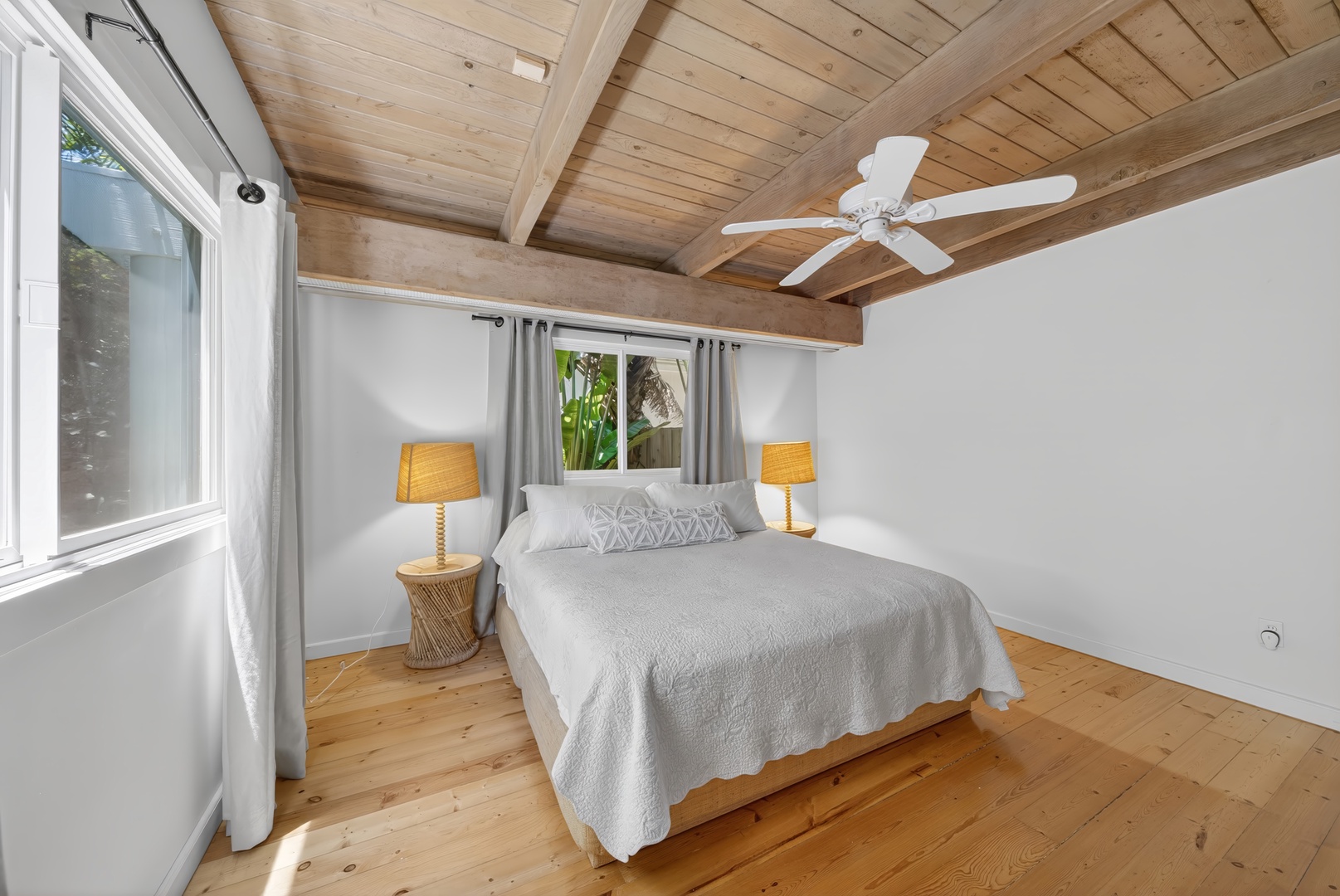 Haleiwa Vacation Rentals, Sunset Beach Hideaway - Rest comfortably in the bright bedroom with vaulted wood ceilings and island breezes.