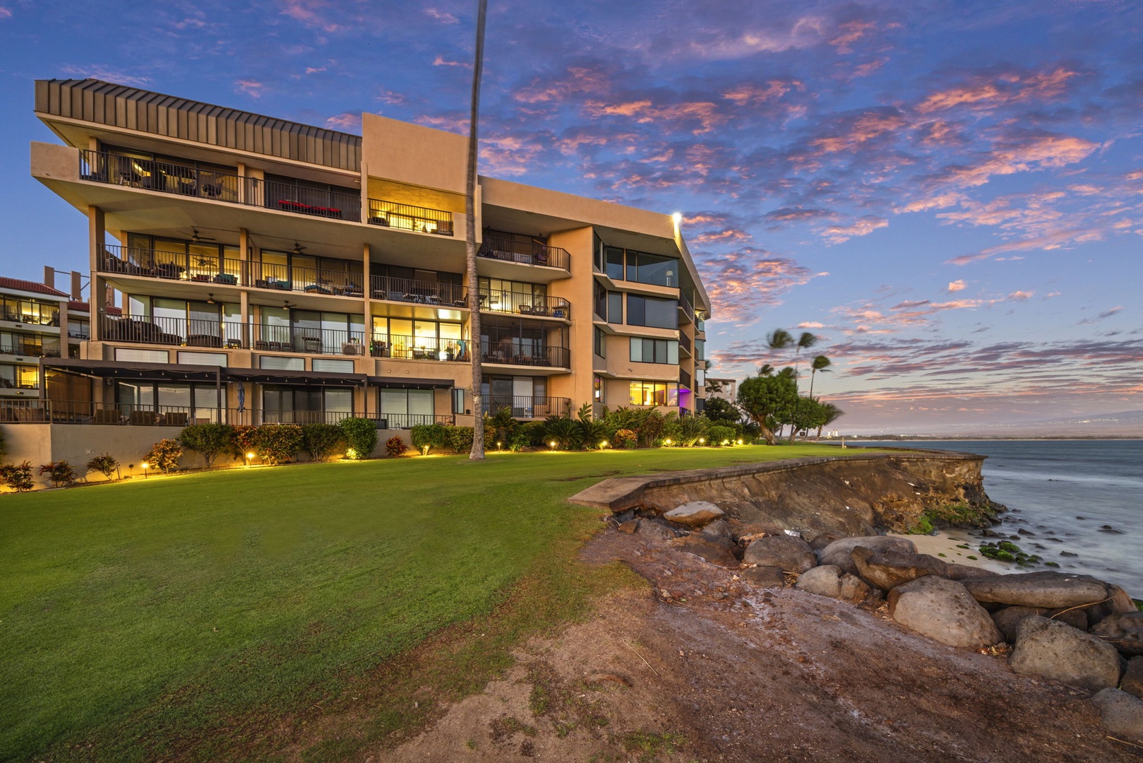 Wailuku Vacation Rentals, Milowai 310 - From this angle, dusk catches the rocky shoreline that starts just past the lawn.