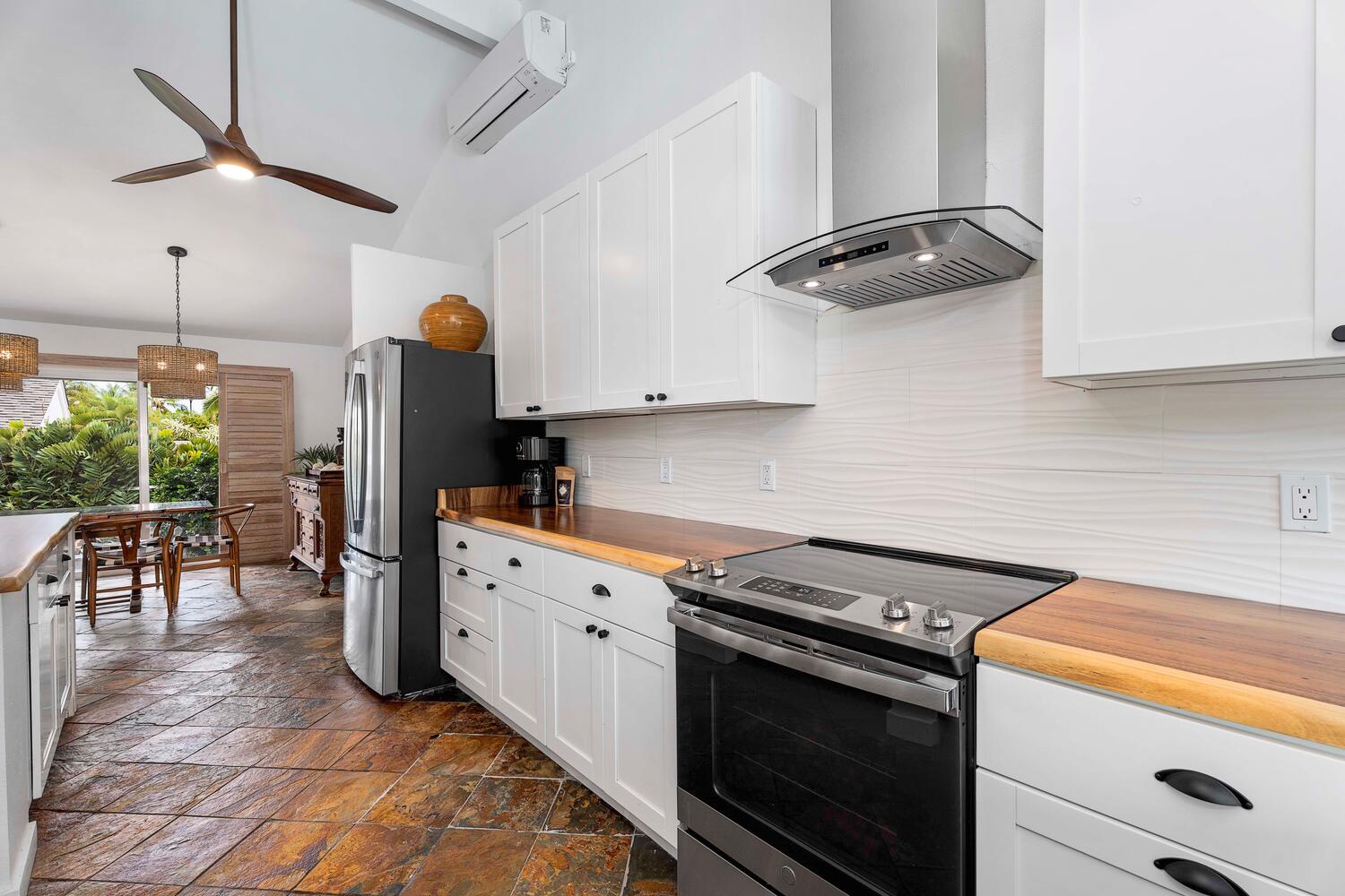 Kailua Kona Vacation Rentals, Manukai Hale - The fully-equipped kitchen has stainless steel appliances and plenty of storage spaces.