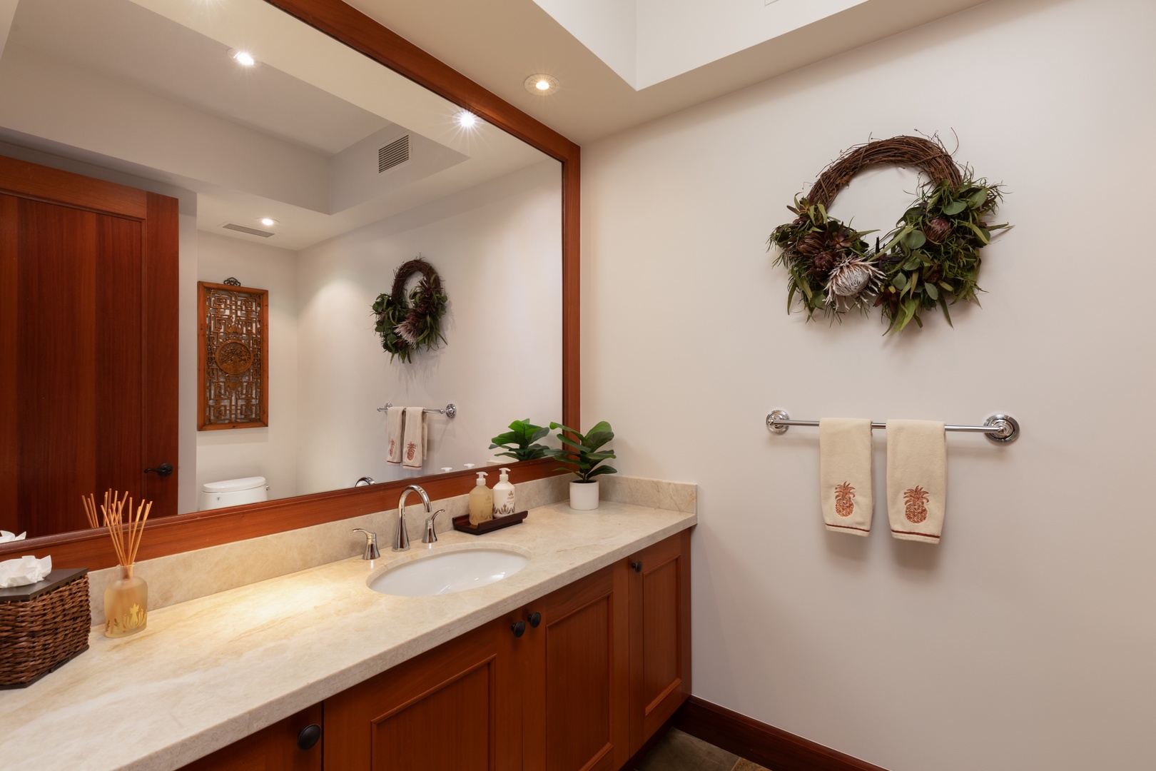 Kailua Kona Vacation Rentals, 3BD Waiulu Villa (111D) at Hualalai Resort - Elegant bathroom with a walk-in shower featuring natural stone tiles.