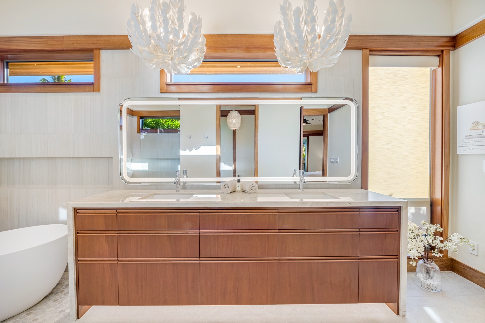 Kamuela Vacation Rentals, Champion Ridge Oasis - Elegant primary ensuite bathroom with a soaking tub, double vanity, and large mirrors.