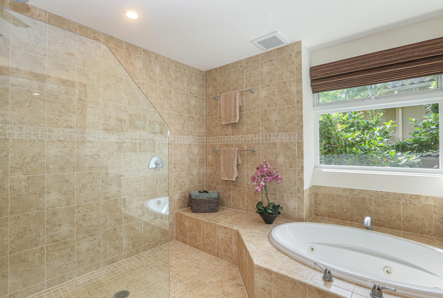Princeville Vacation Rentals, Hale Moana - Jacuzzi tub and walk-in shower in the primary bedroom's ensuite bathroom