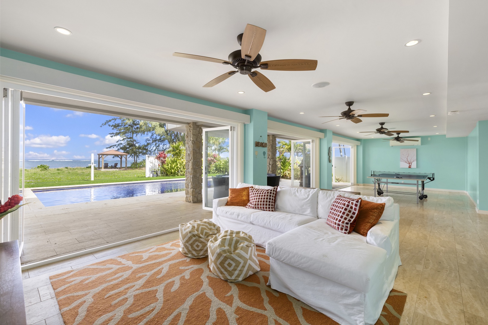 Waialua Vacation Rentals, Kala'iku* - First-floor media area, which opens to the pool.