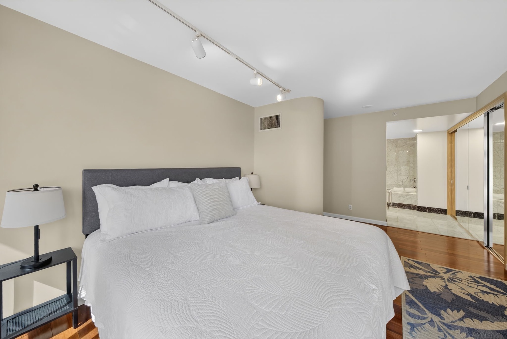 Honolulu Vacation Rentals, Island View at Waikiki Landmark - Recharge in this quiet bedroom with plush bedding and nearby ensuite bathroom access.