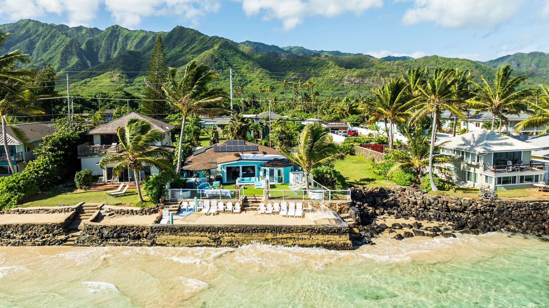 Hauula Vacation Rentals, Private Beach Paradise - Oceanfront property nestled between lush mountains and turquoise waters with direct beach access.