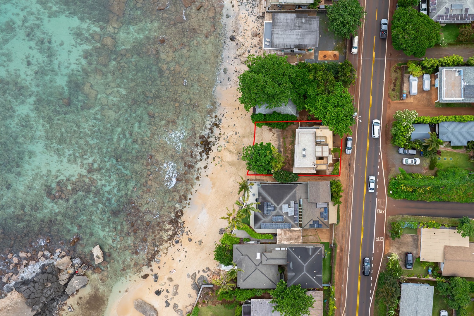 Haleiwa Vacation Rentals, HaleGator - Bird's-eye view showcasing the home's direct shoreline location with easy access to beach walks, ocean views, and coastal adventures.