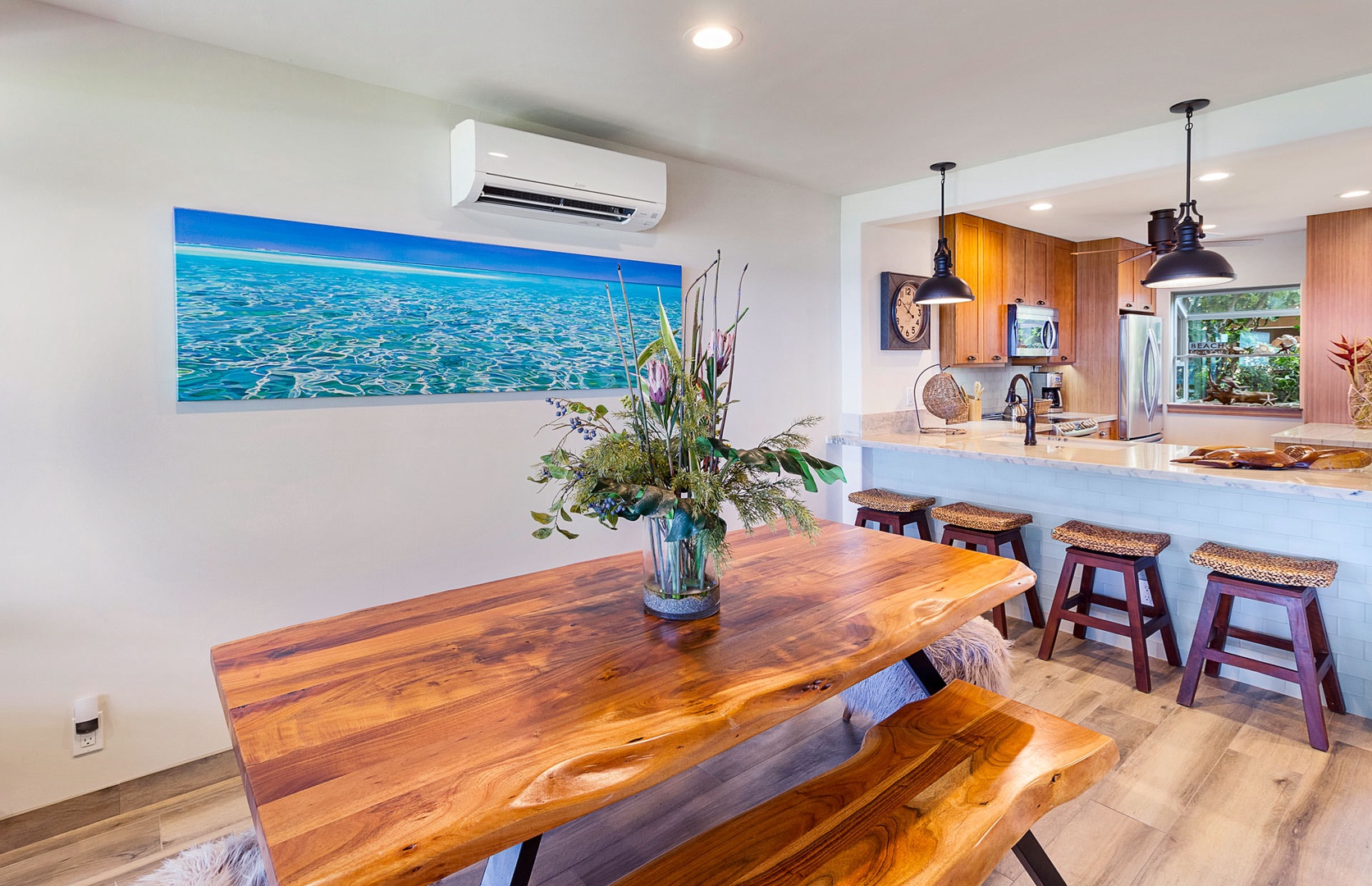 Lahaina Vacation Rentals, Puamana 240-3 - Gather around the rustic wooden dining table, perfect for family meals or lively conversations.