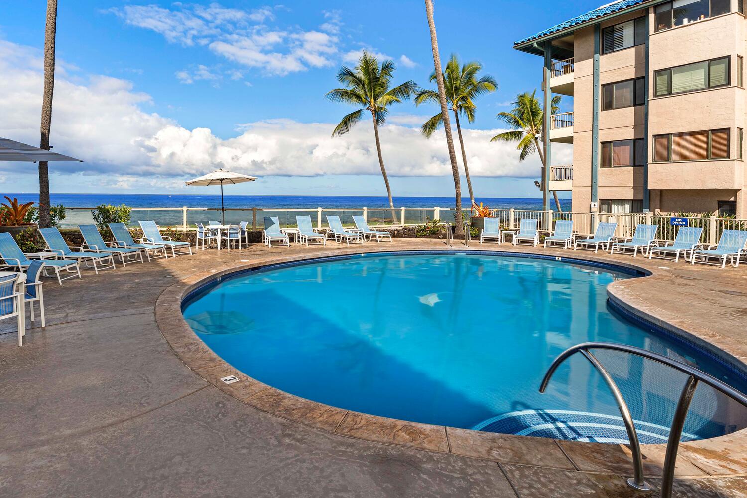 Kailua Kona Vacation Rentals, Kona Reef F23 - Lounge poolside with panoramic ocean views.