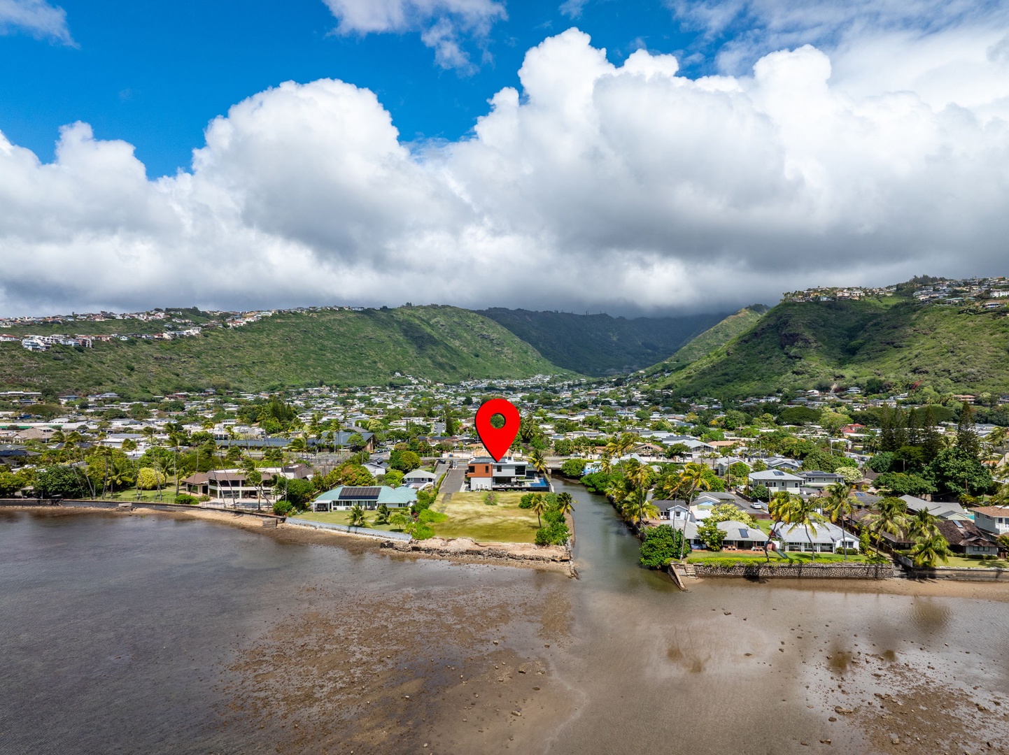 Honolulu Vacation Rentals, Ocean Villa 3 Bedroom - Aerial perspective highlighting the home's waterfront location within a coastal neighborhood.
