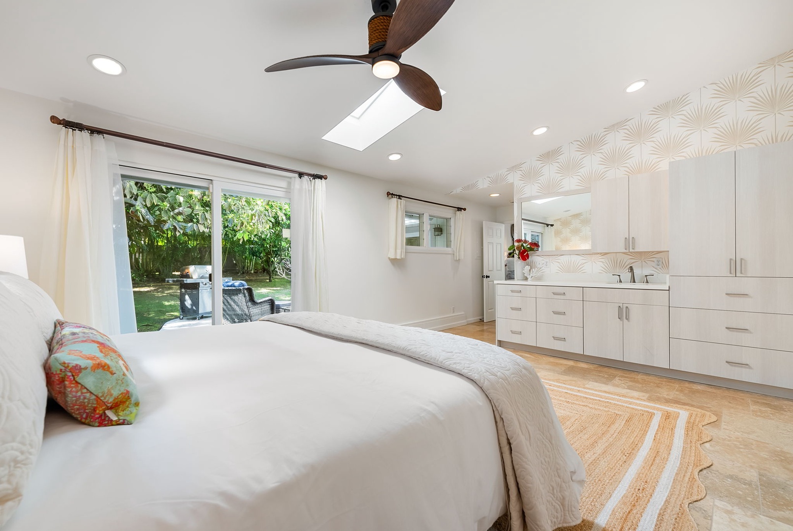 Kailua Vacation Rentals, Nohie Lanikai - A dreamy primary suite with a king-size bed and private access to the lush outdoor space.